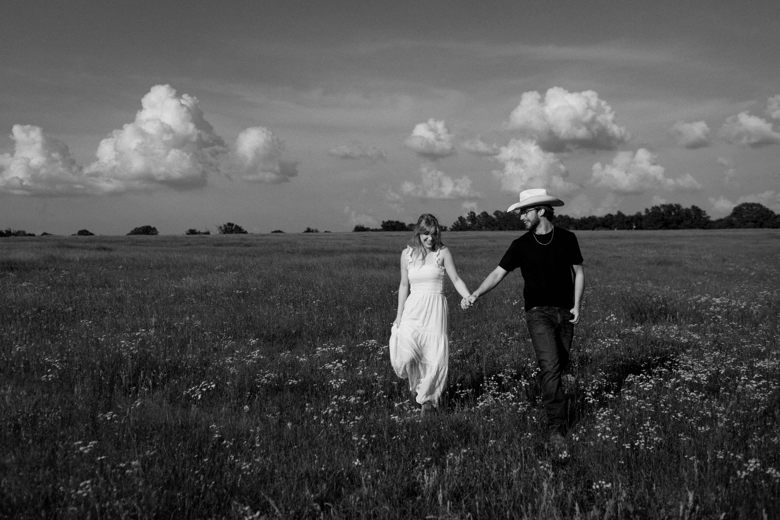 A groom taking in the view of his bride-to-be - documentary style engagement session in East Texas.