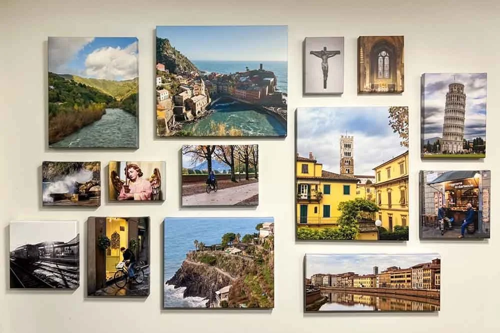 Gallery wall featuring fine art photography displayed in a variety of sizes and layouts for home or office design inspiration.