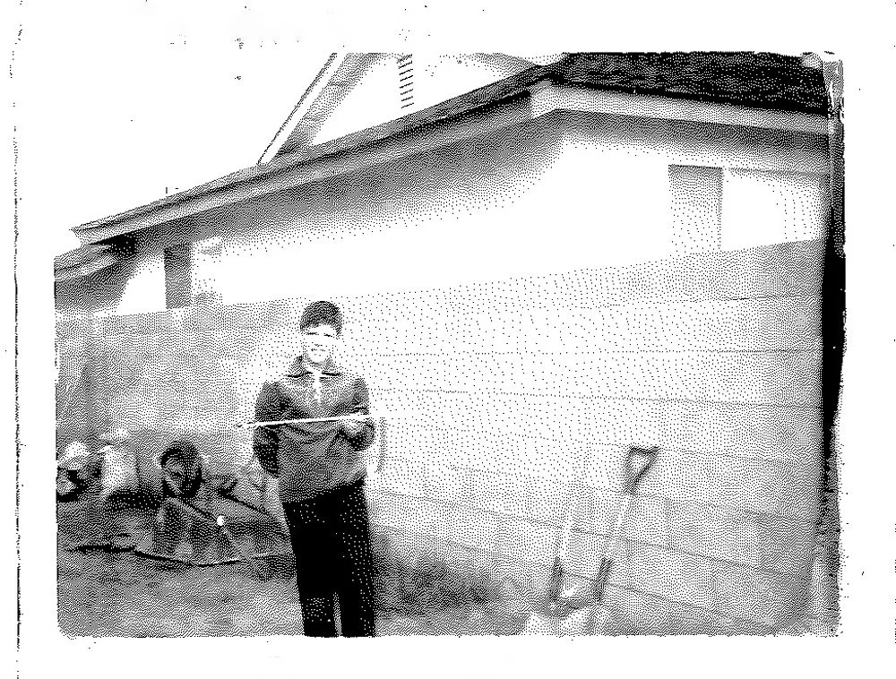 Young boy outdoors, representing the early beginning of Lyle Lansdell’s photography journey.