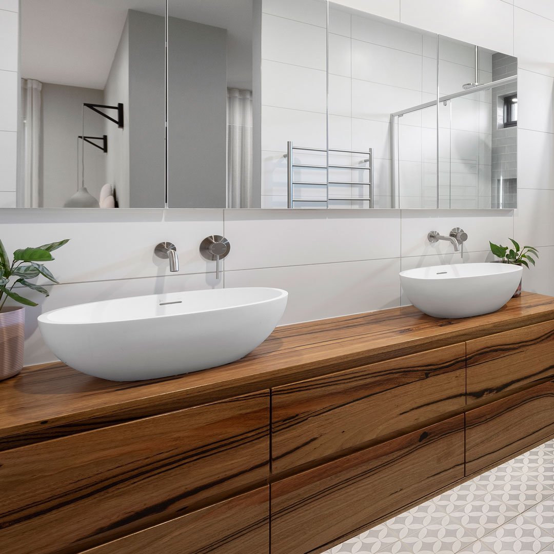 Love the combination of cool tile tones matched with warm timber tones 😍

This custom ensuite and bathroom compliment one another beautifully.

Do you have plans for a custom build or extension? Contact us today to discuss how C.A.M Constructions ca
