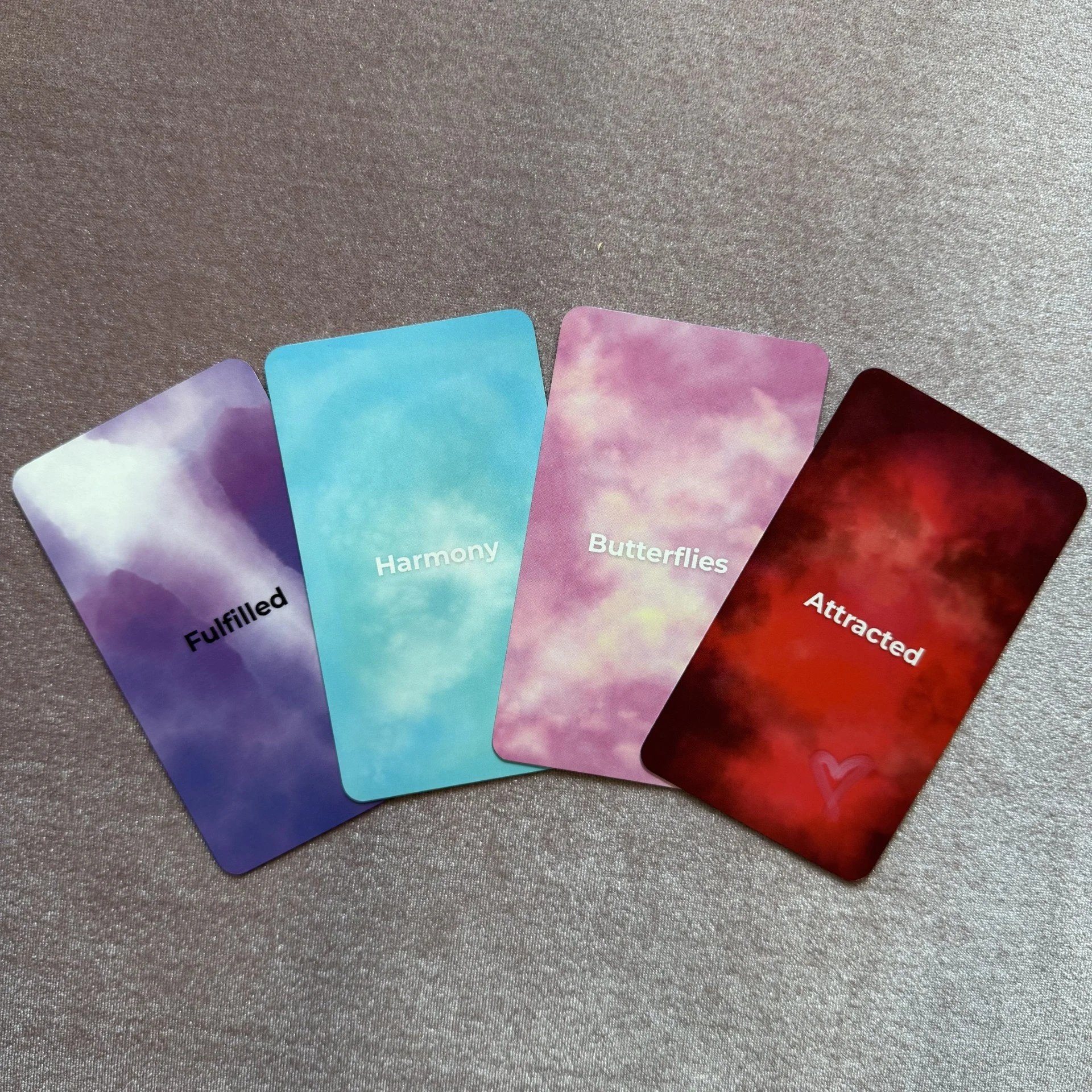 Empowered Emotion Oracle colorful card faces including Harmony, Butterflies, and Attracted.