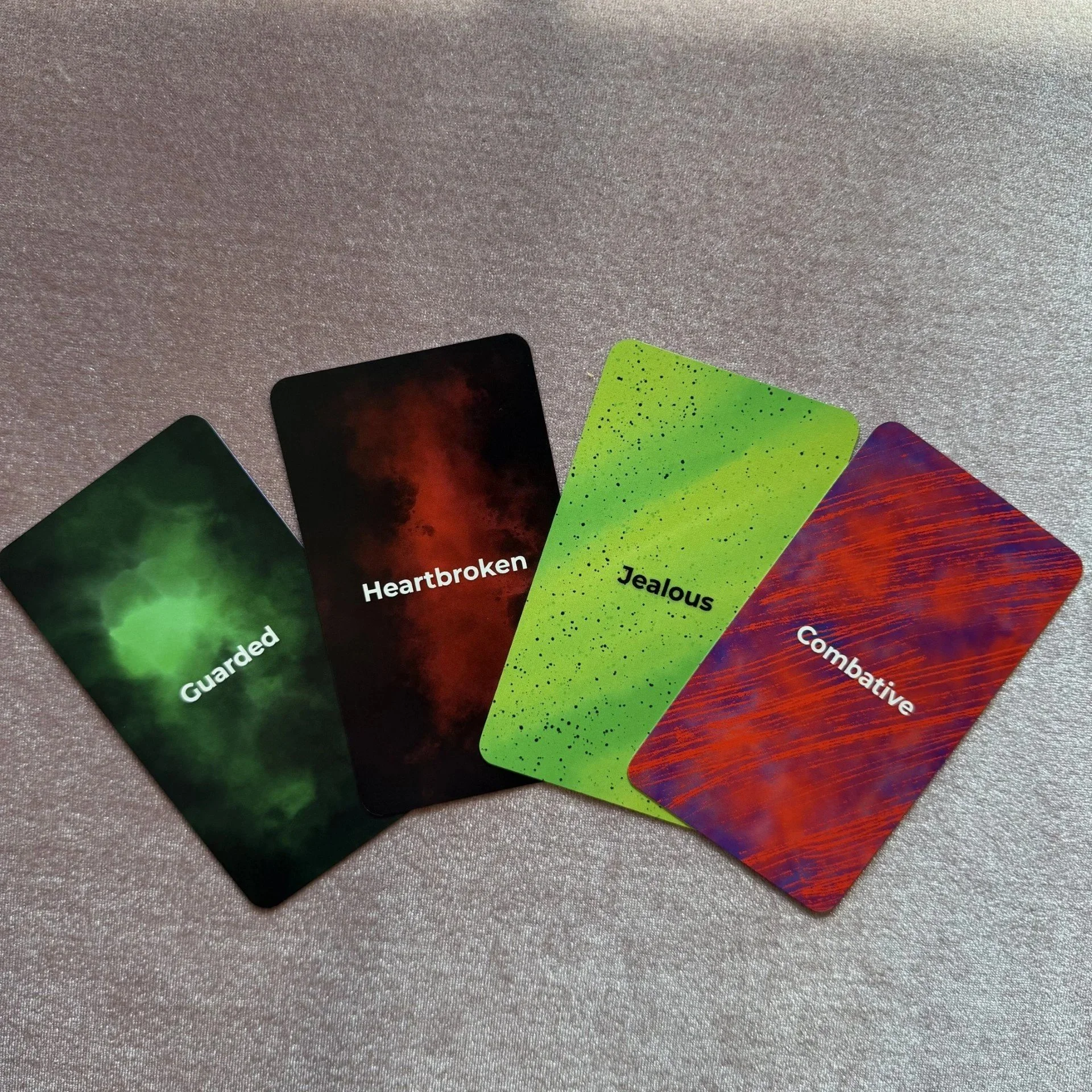 Empowered Emotions Oracle dark emotion cards including Guarded, Heartbroken, and Jealous.