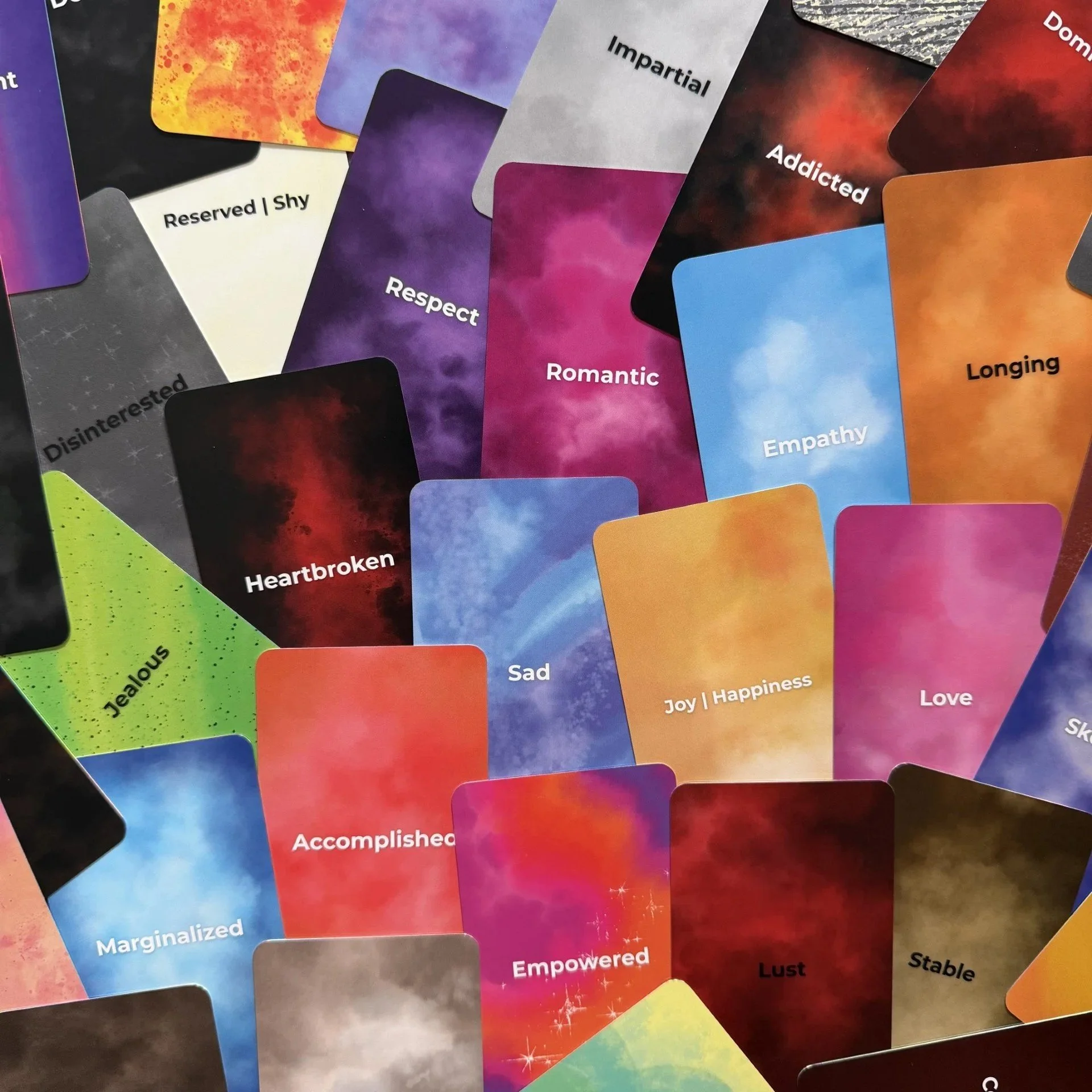 Empowered Emotions Oracle scattered card faces showing full color range.