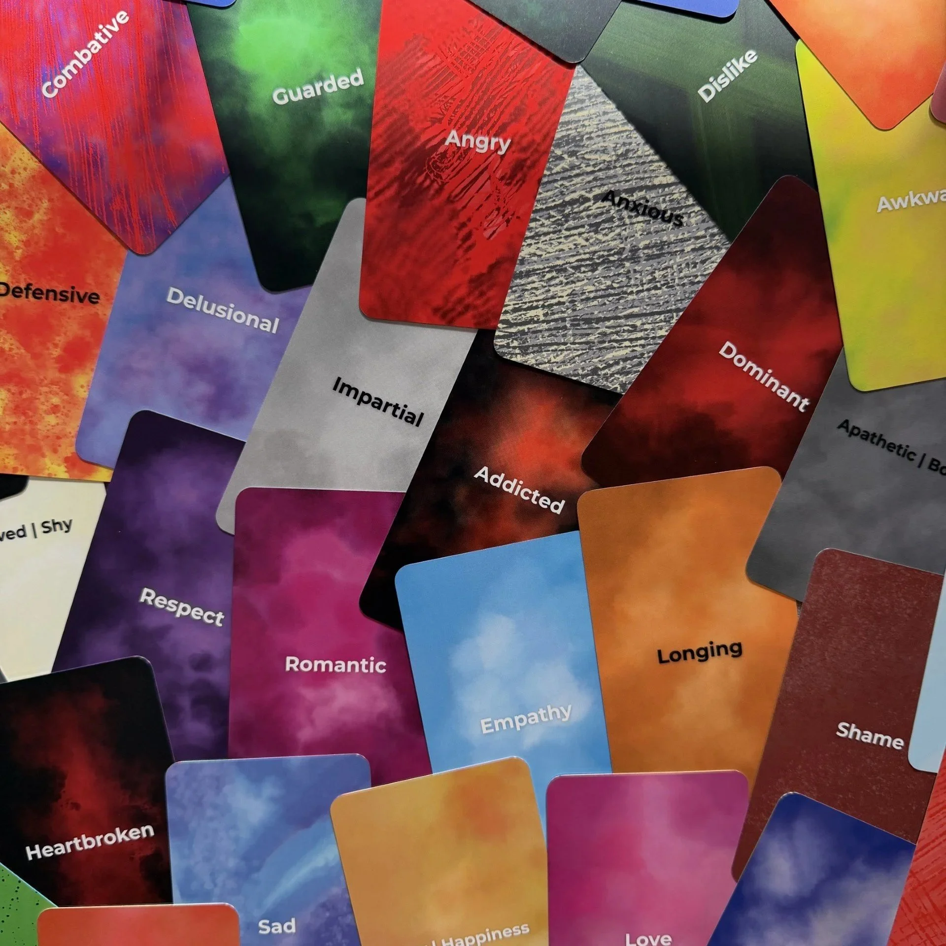 Empowered Emotions Oracle scattered card faces showing full color range. 