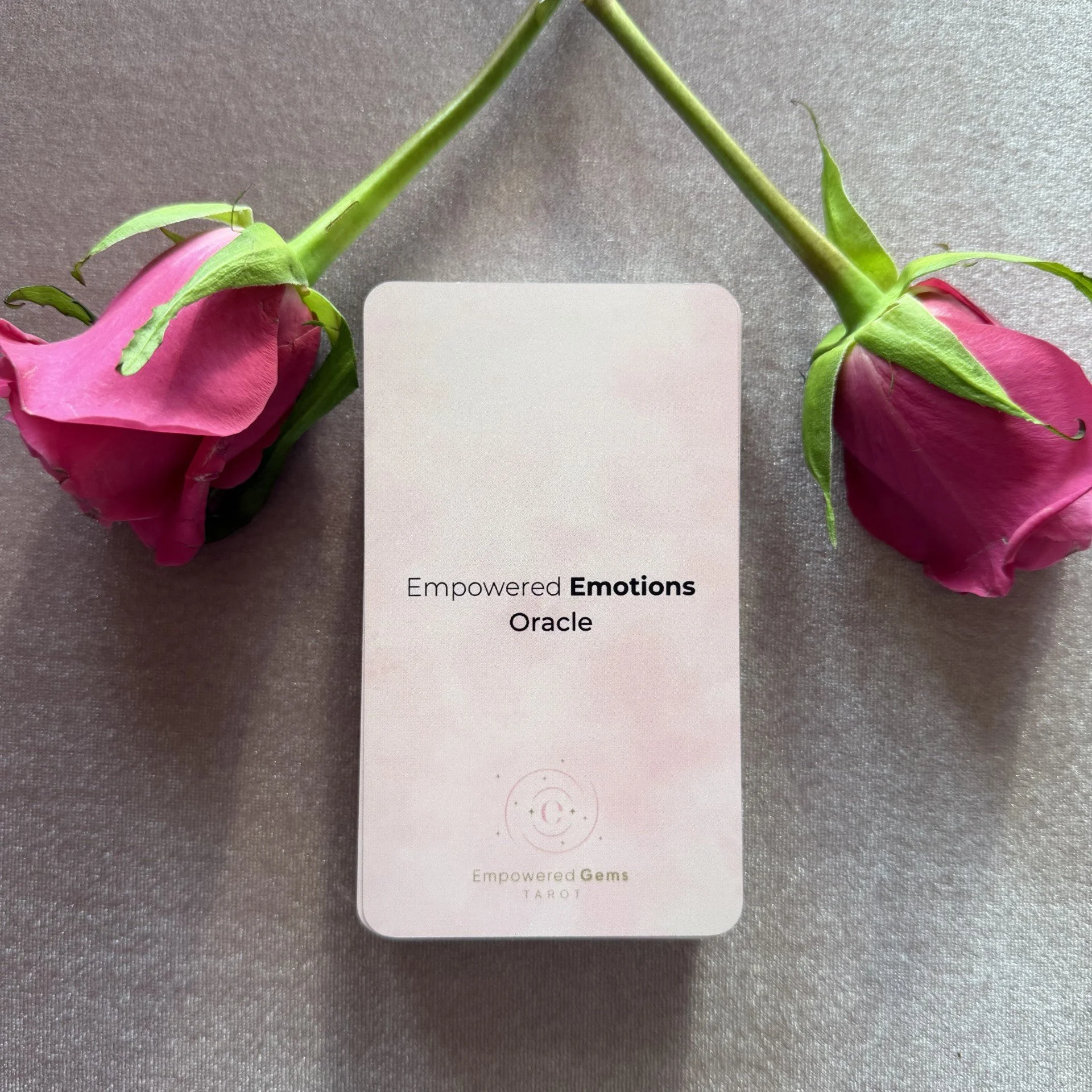 Empowered Emotions Oracle deck with pink roses on mauve background.