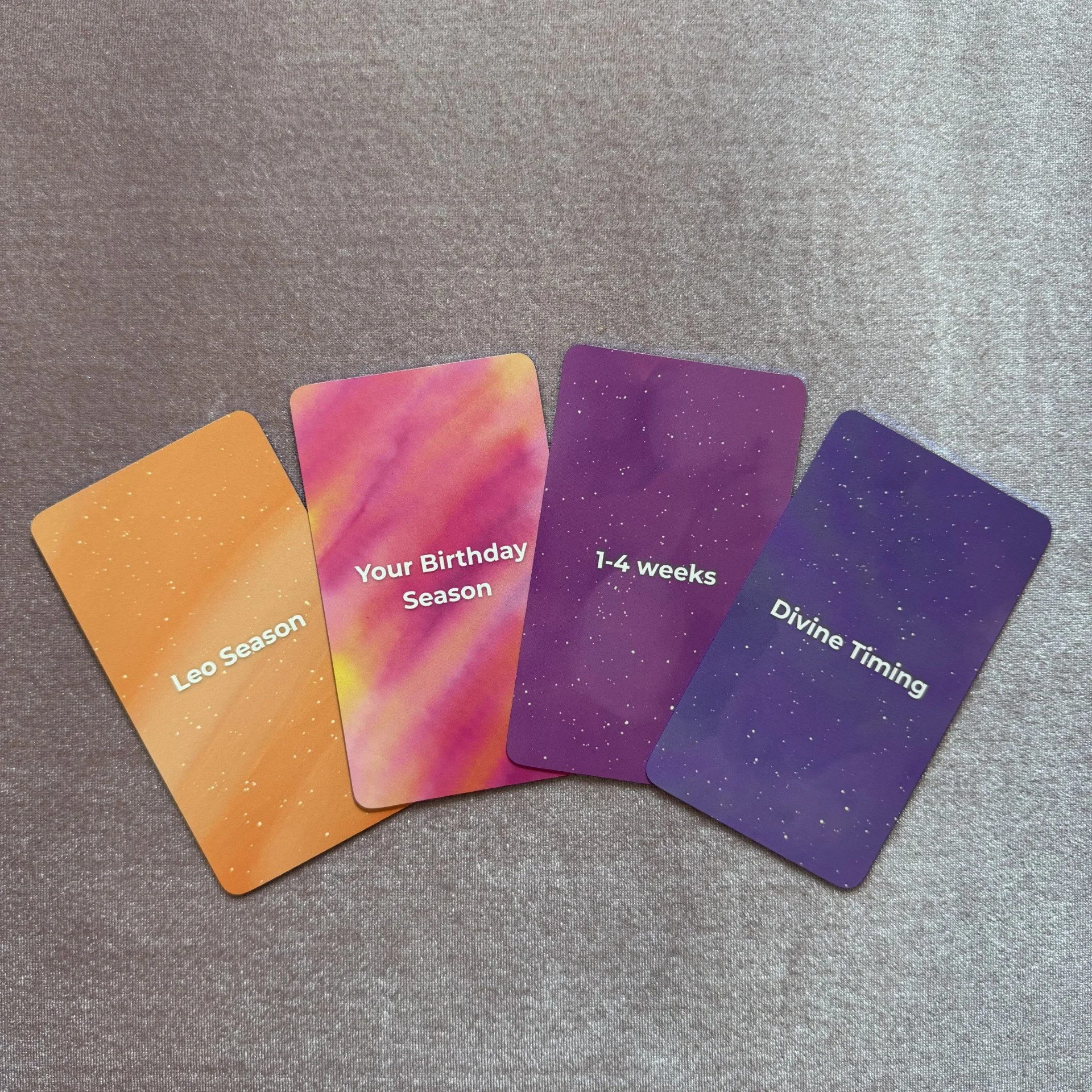 Empowered Timing Oracle colorful card faces including Leo Season, Your Birthday Season, and Diving Timing