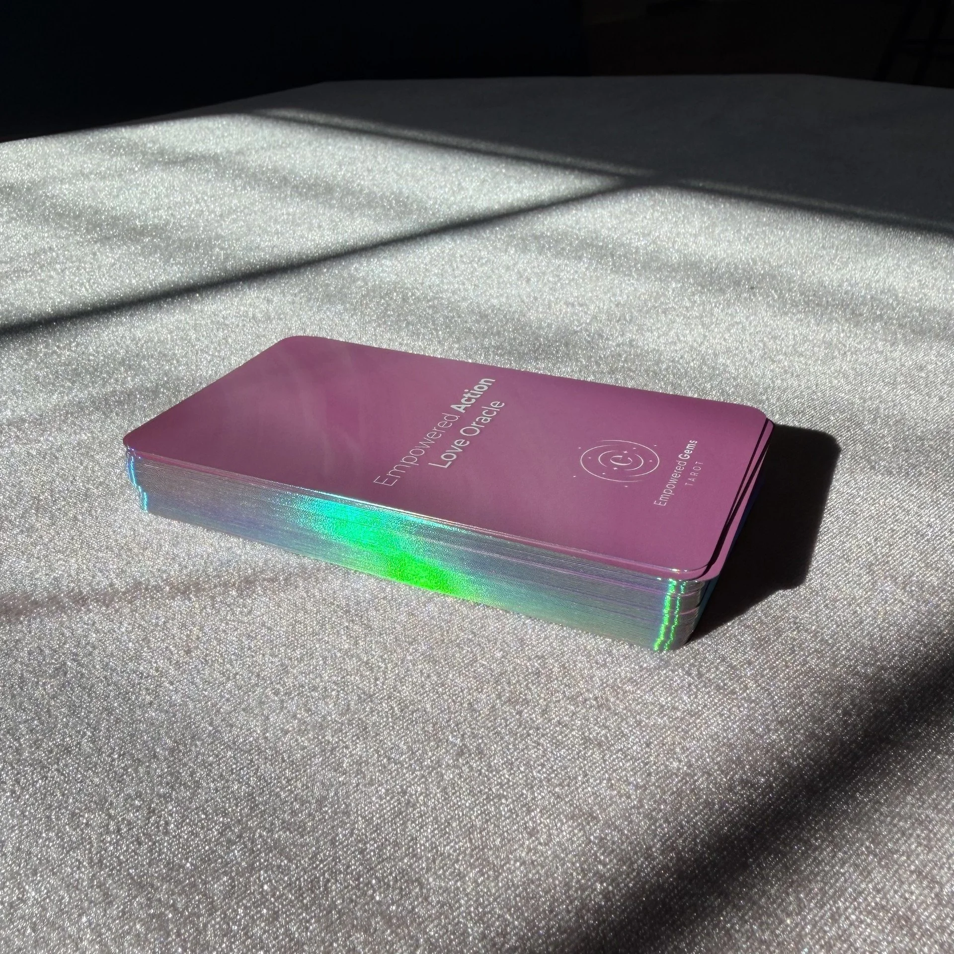 Empowered Action Love Oracle holographic gilt edge card deck in sunlight