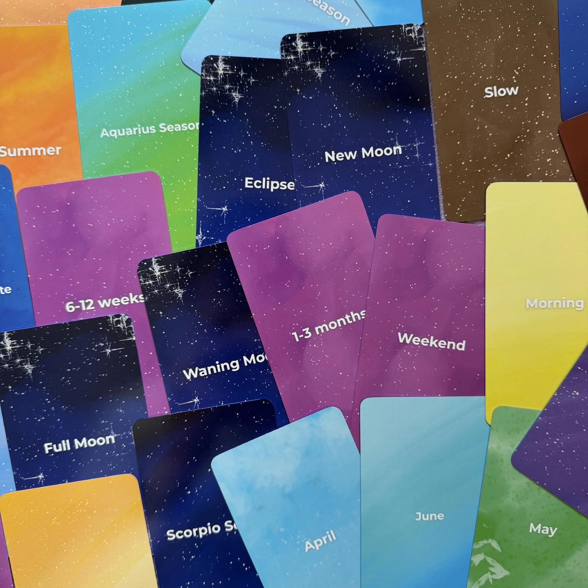 Empowered Timing Oracle scattered card faces showing full color range