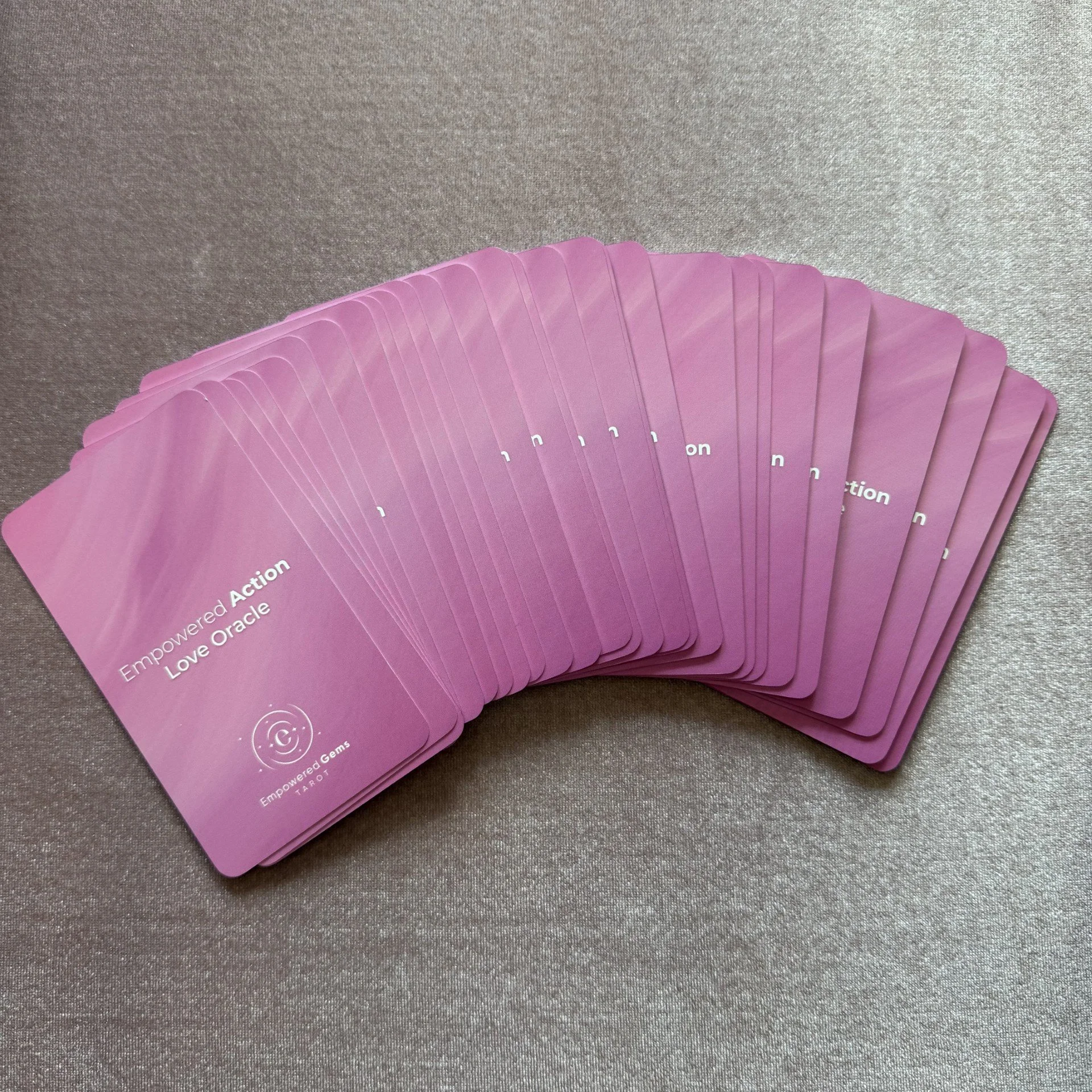Empowered Action Love Oracle 50 card fan spread on mauve background