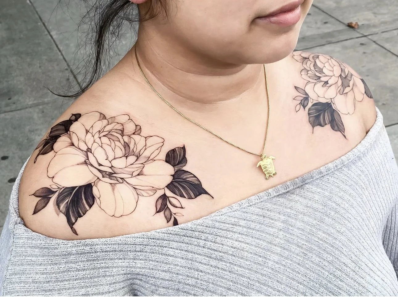 Peony flowers on shoulder