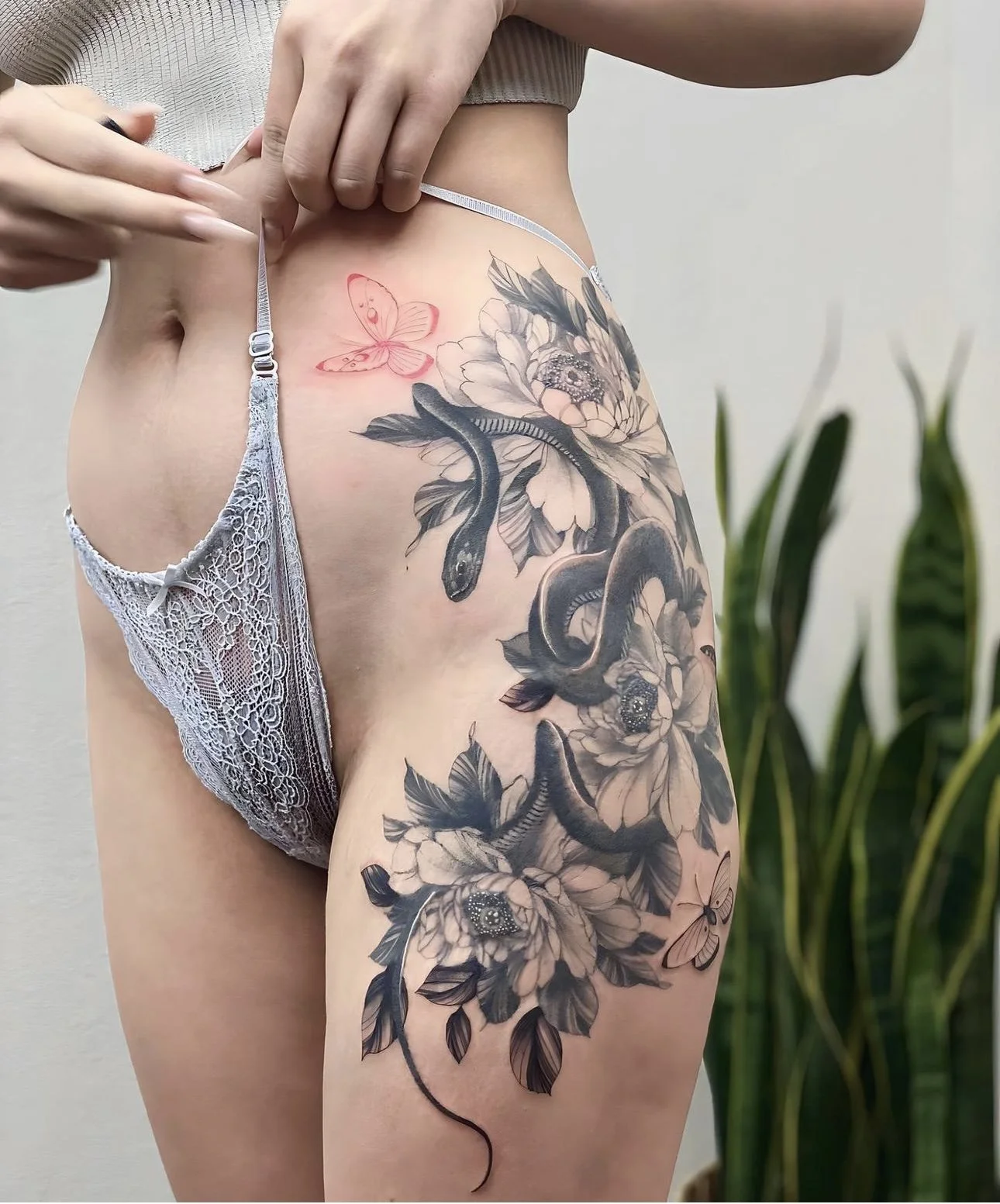 Snake and peony flower fine line on thigh