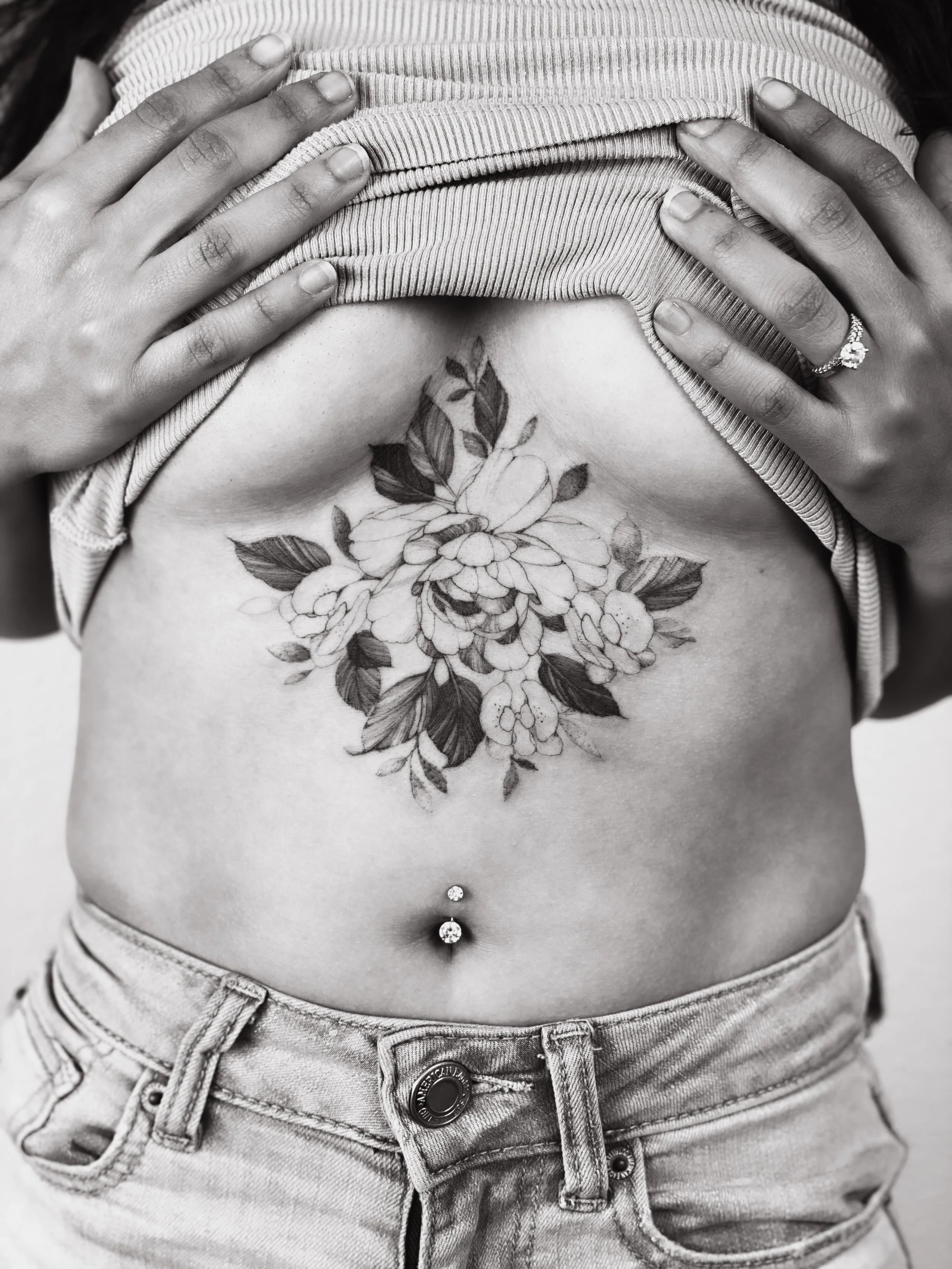 Best bay area fine line floral tattoo on sternum