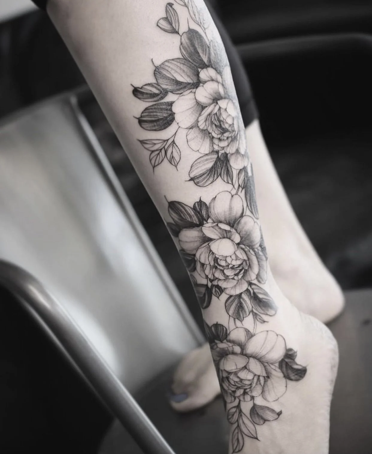 fine line flora leg tattoo