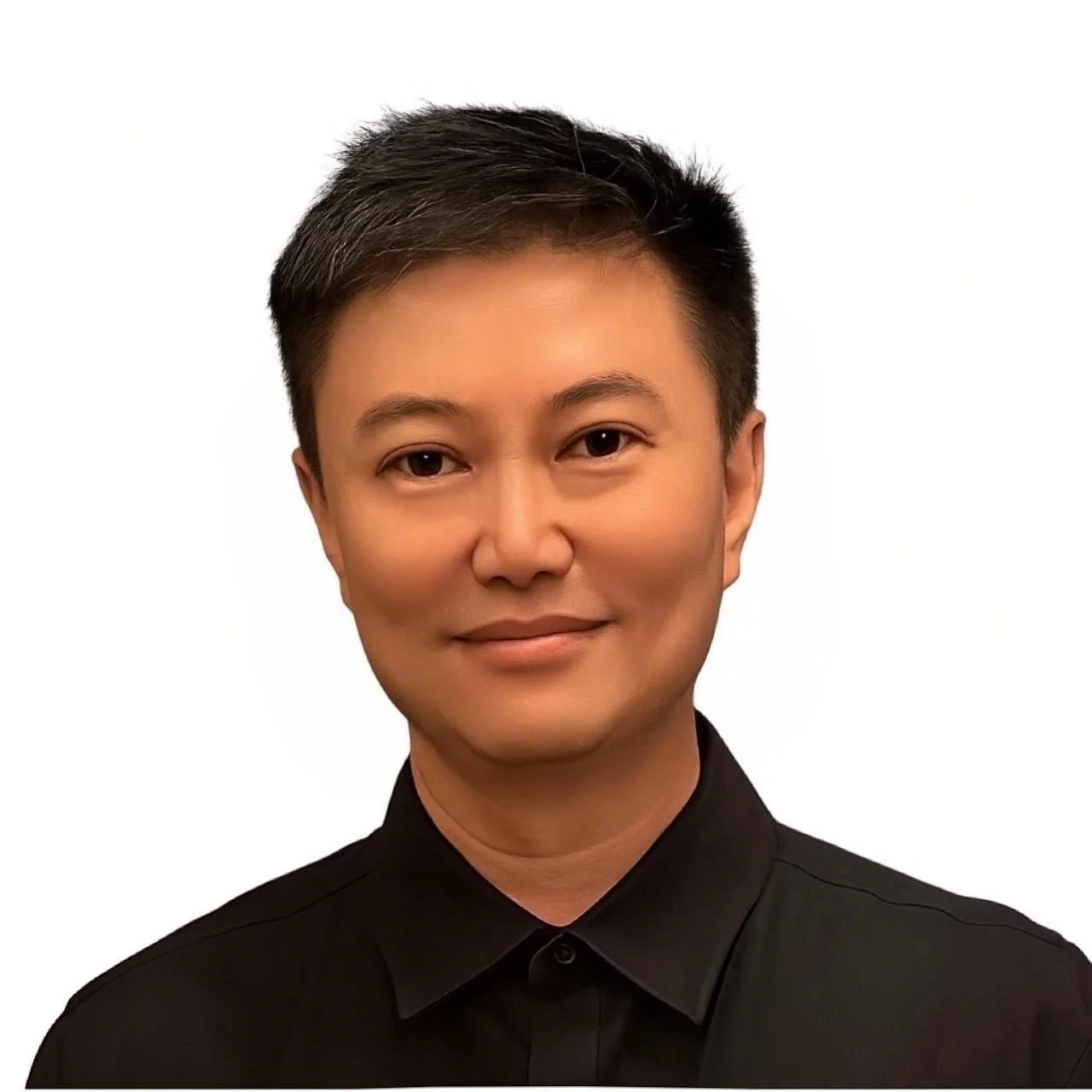 Headshot of a person with short, black hair, wearing a black button-up shirt, smiling slightly, against a plain white background.