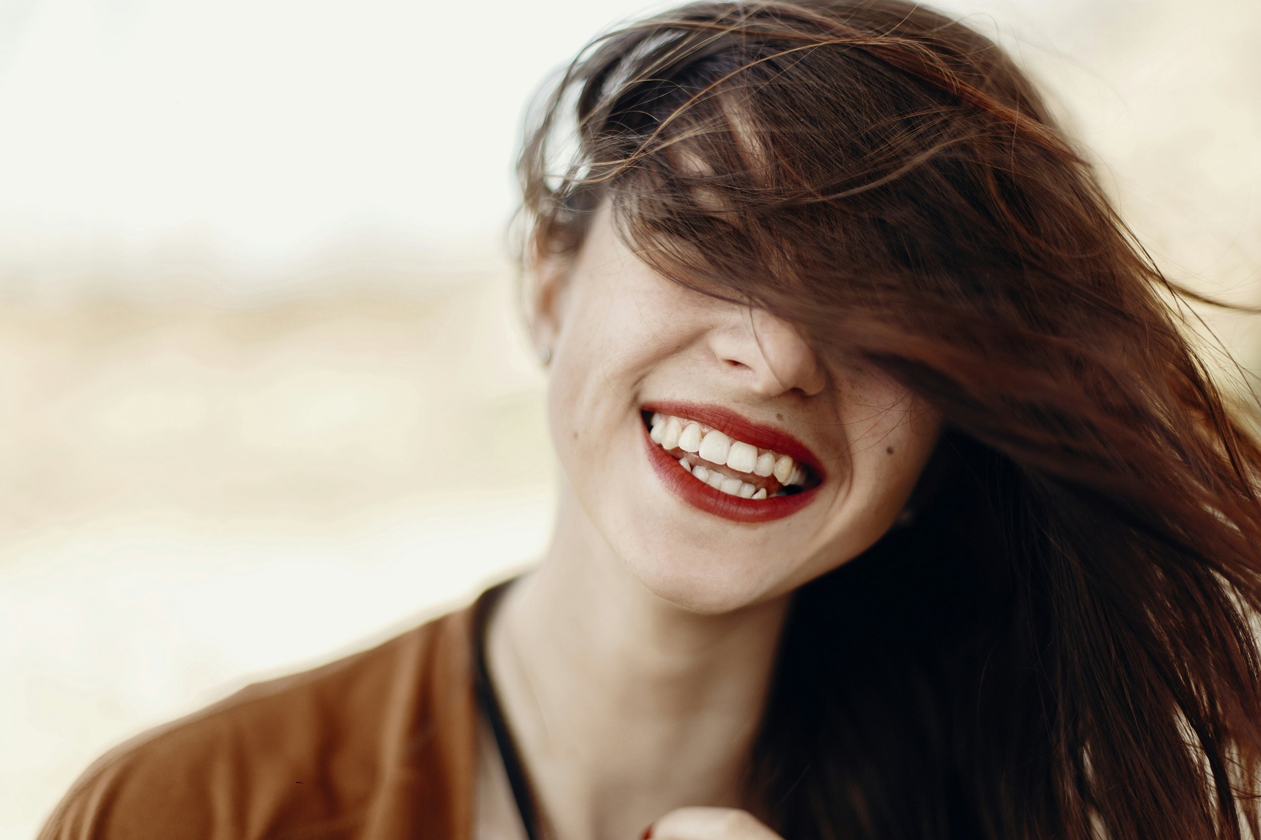 Woman smiling with red lipstick