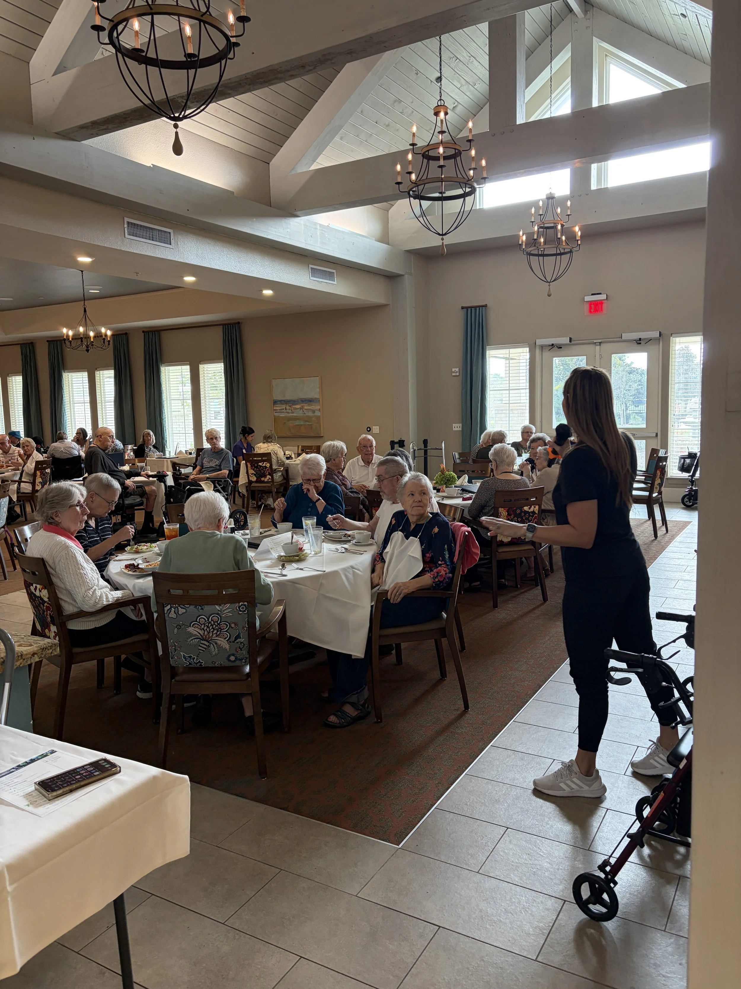 Paige Denny presenting a home mobility and aging-in-place education program to a senior community audience in Houston.