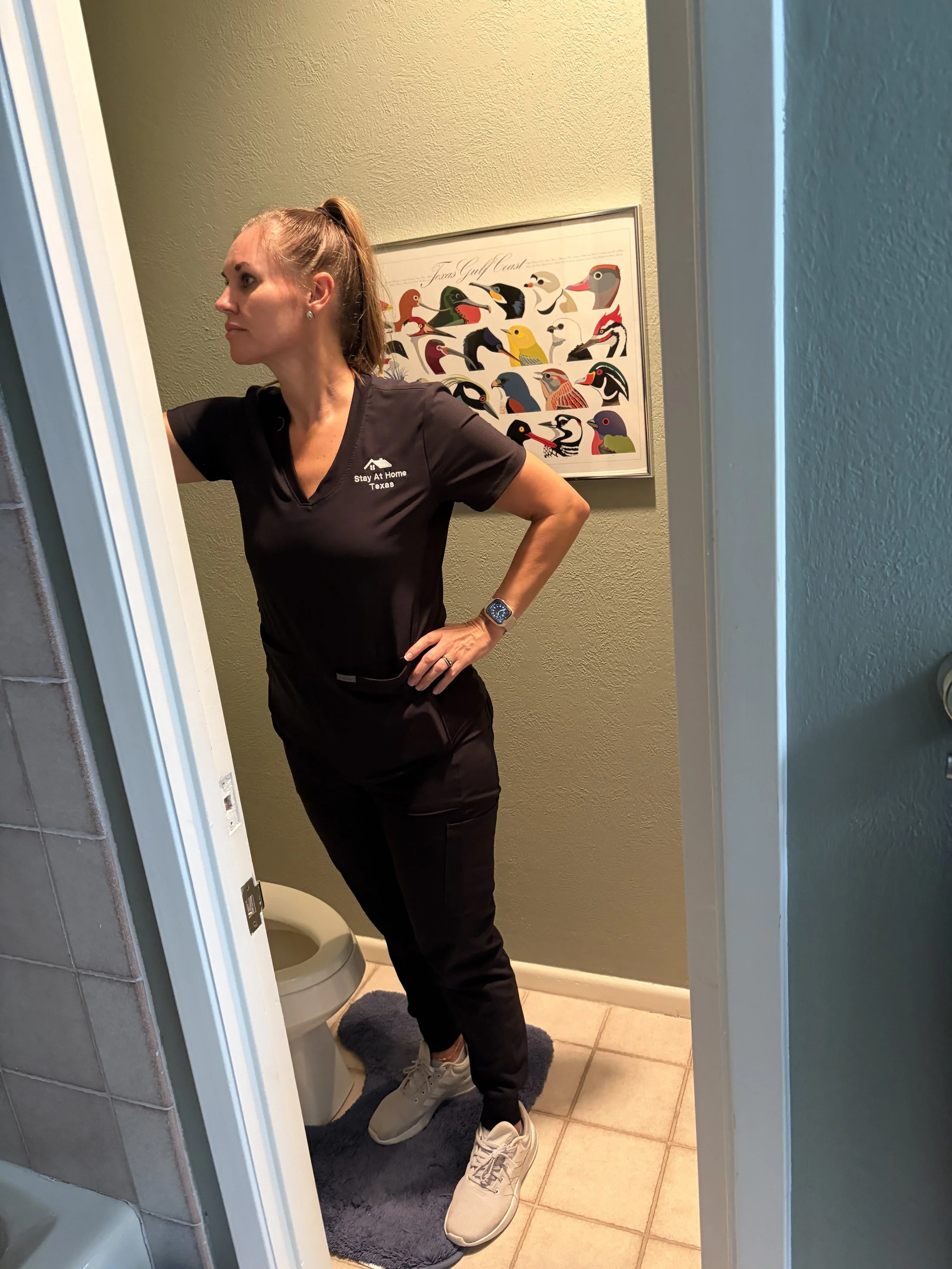 Doctor of Physical Therapy assessing a bathroom and doorway during an in-home Home Mobility Planning consultation in Houston.