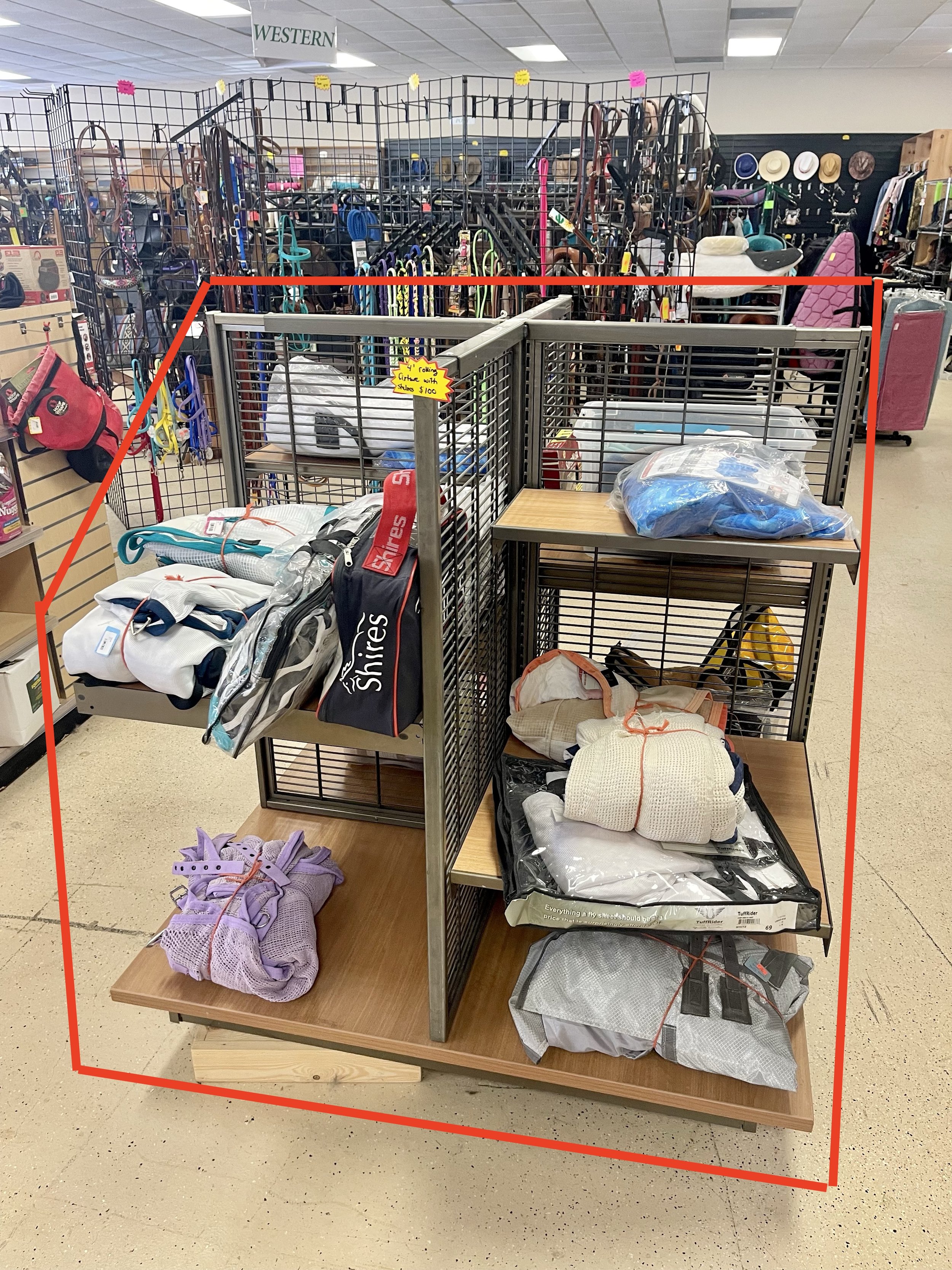 Lot 36
4' 4 sided rolling wooden and metal freestanding shelving fixture, $100