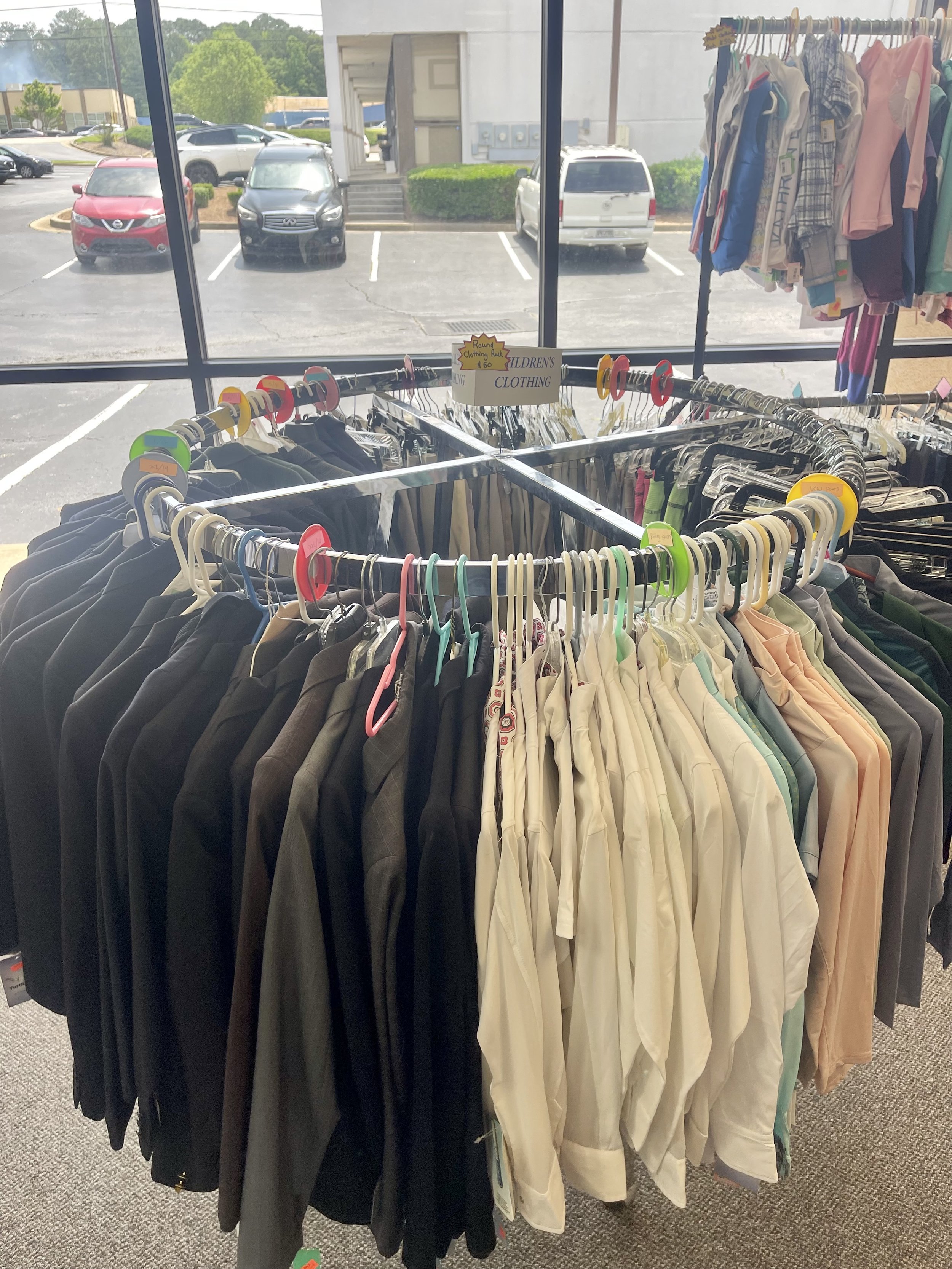 Lot 12
4' Round silver rolling clothing rack, $50