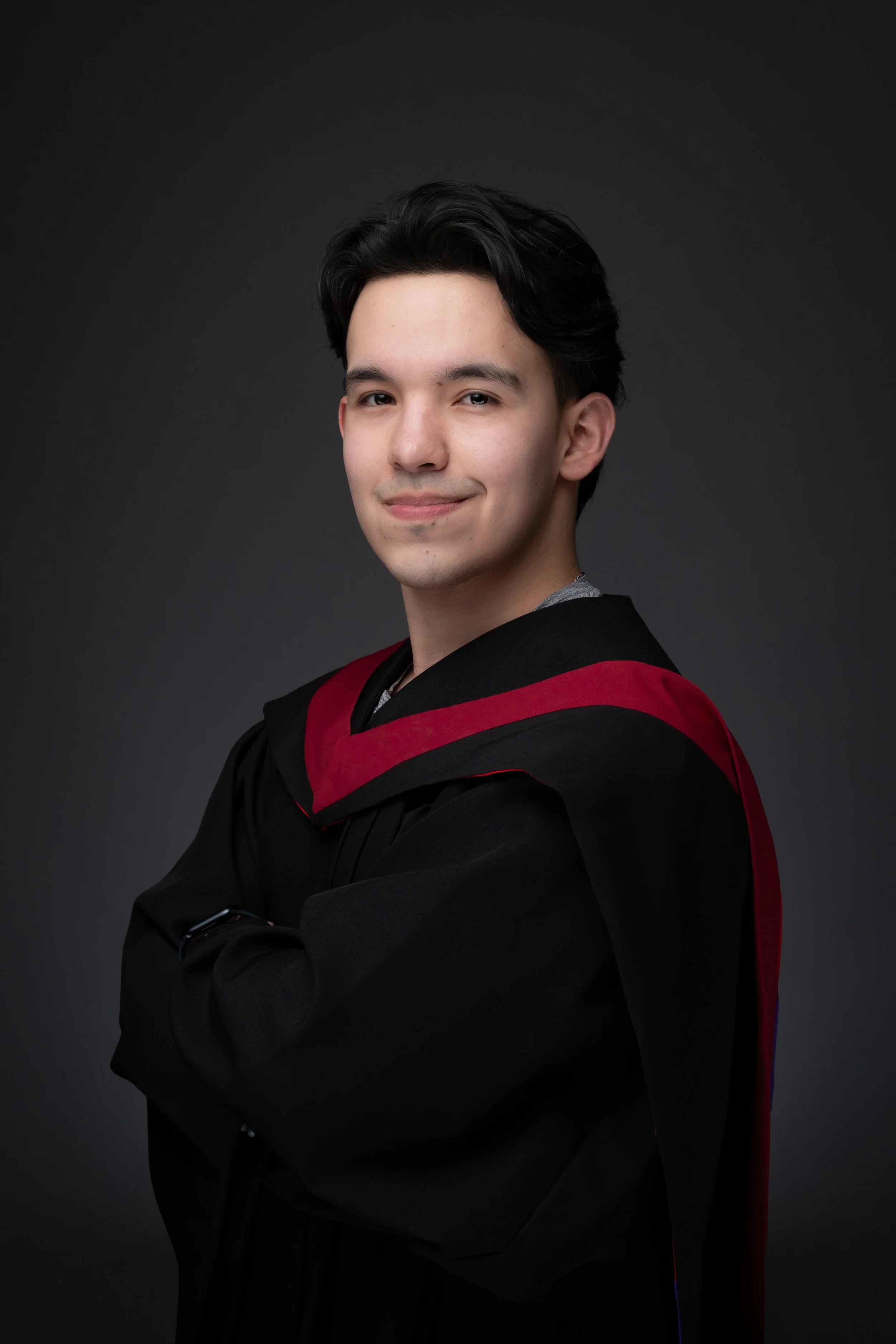 TRU graduate posing in a side angle