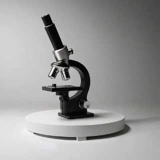 Microscopio negro sobre una plataforma blanca iluminada.