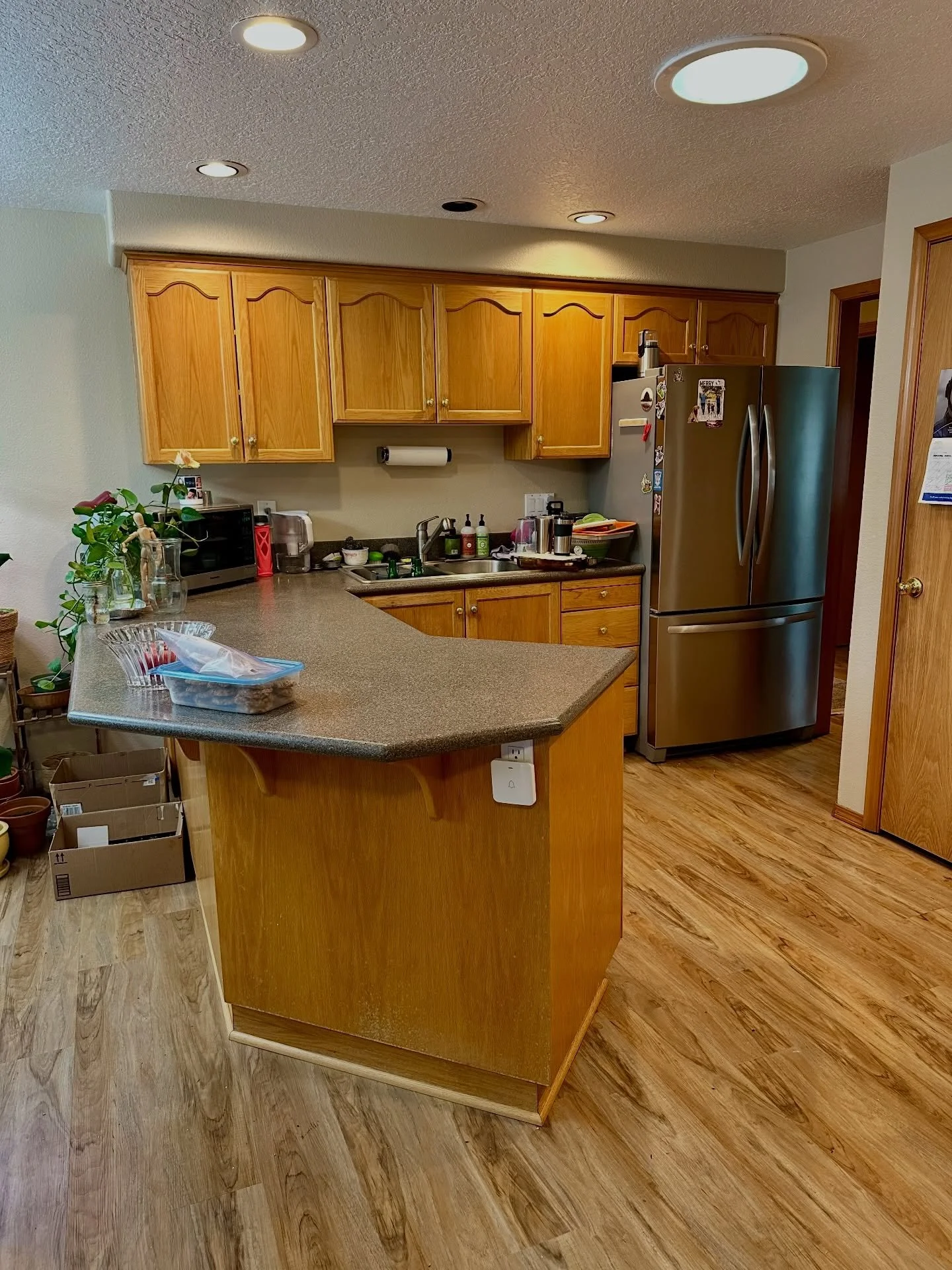 The kitchen is the heart of the home, but it sometimes becomes a dumping ground. 

This client needed help decluttering and getting organizing systems in place so that she and her husband could cook meals and sit at the dining room together for some 