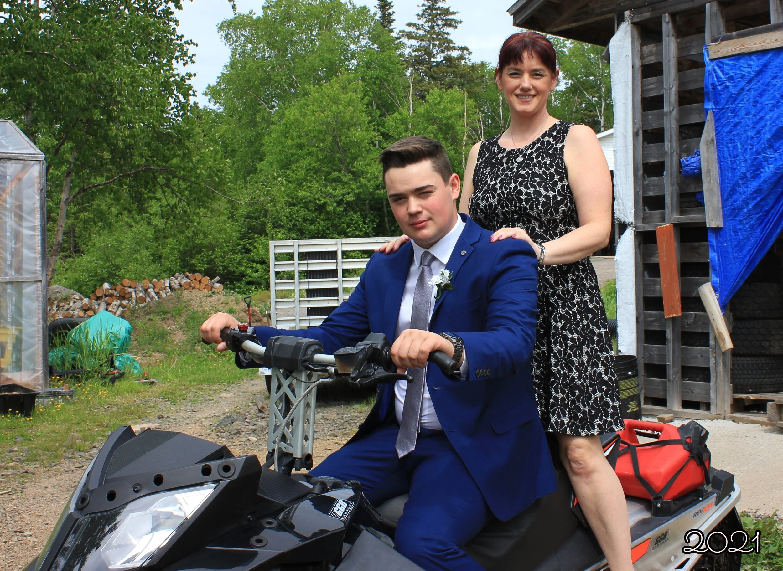 Jeremy and mom on skidoo.jpg