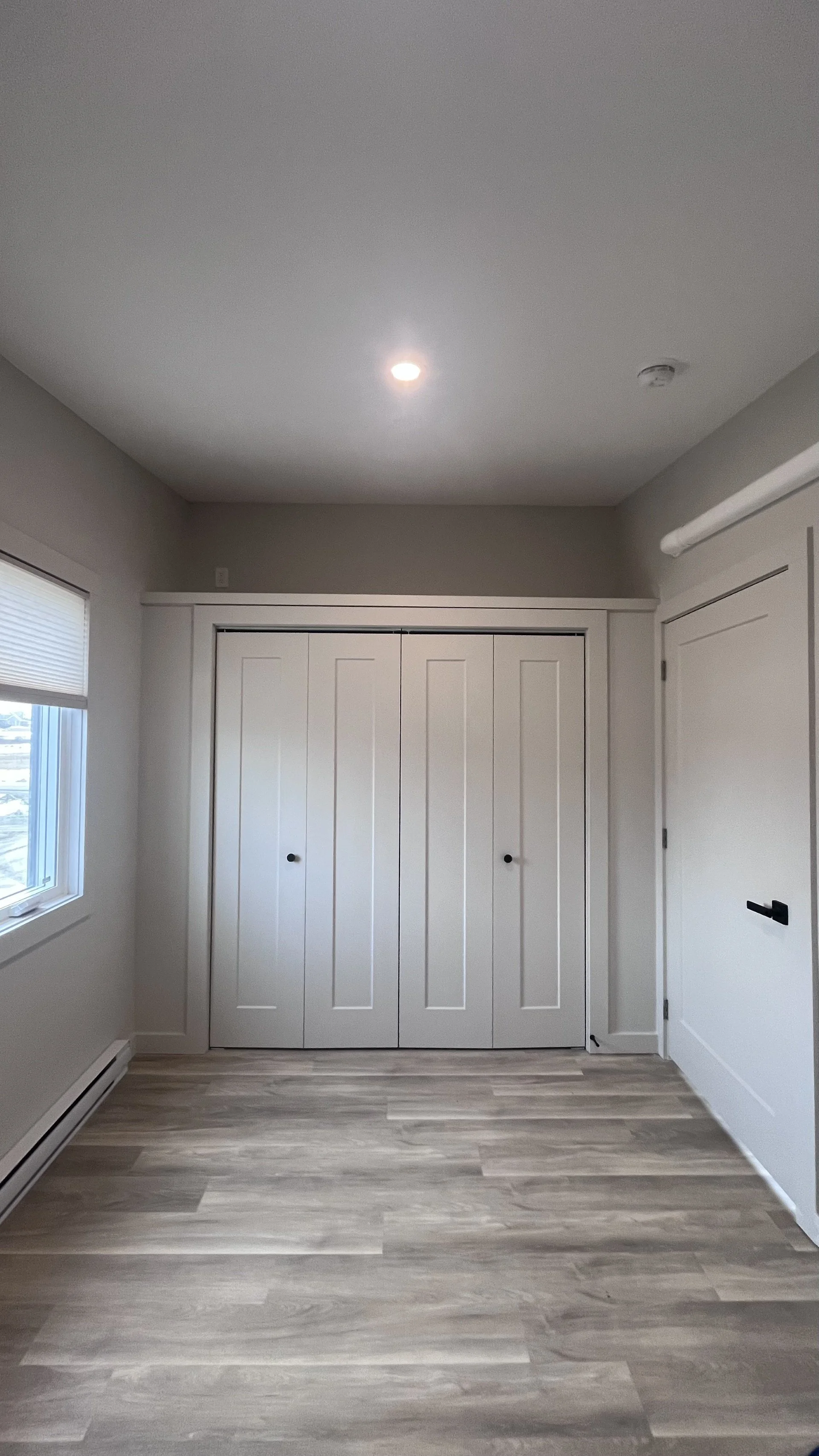 8' Bedroom closet with organizer and additional storage above