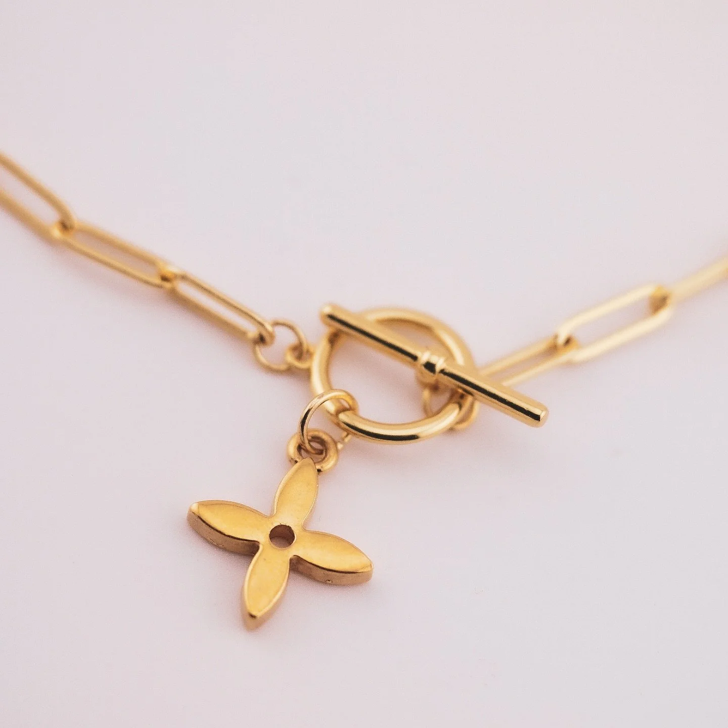 &Eacute;TINCELLE &mdash; a spark worth keeping. ✨
Repurposed from an authentic vintage Louis Vuitton charm, this piece features a gold-plated chainlink, bold toggle clasp, and signature LV star.
Honour your bloom. Trust the wilt.
Crafted for contrast