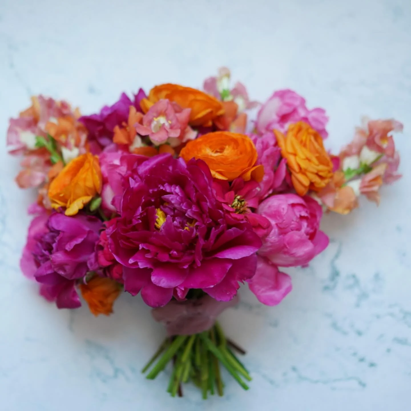 I typically gravitate towards whimsical greenery such as sweet pea vines and bells of Ireland, along with pastel white flowers, so this vibrant and colorful bouquet was an extremely fun departure from what I usually create! Happy wedding day Hannah a