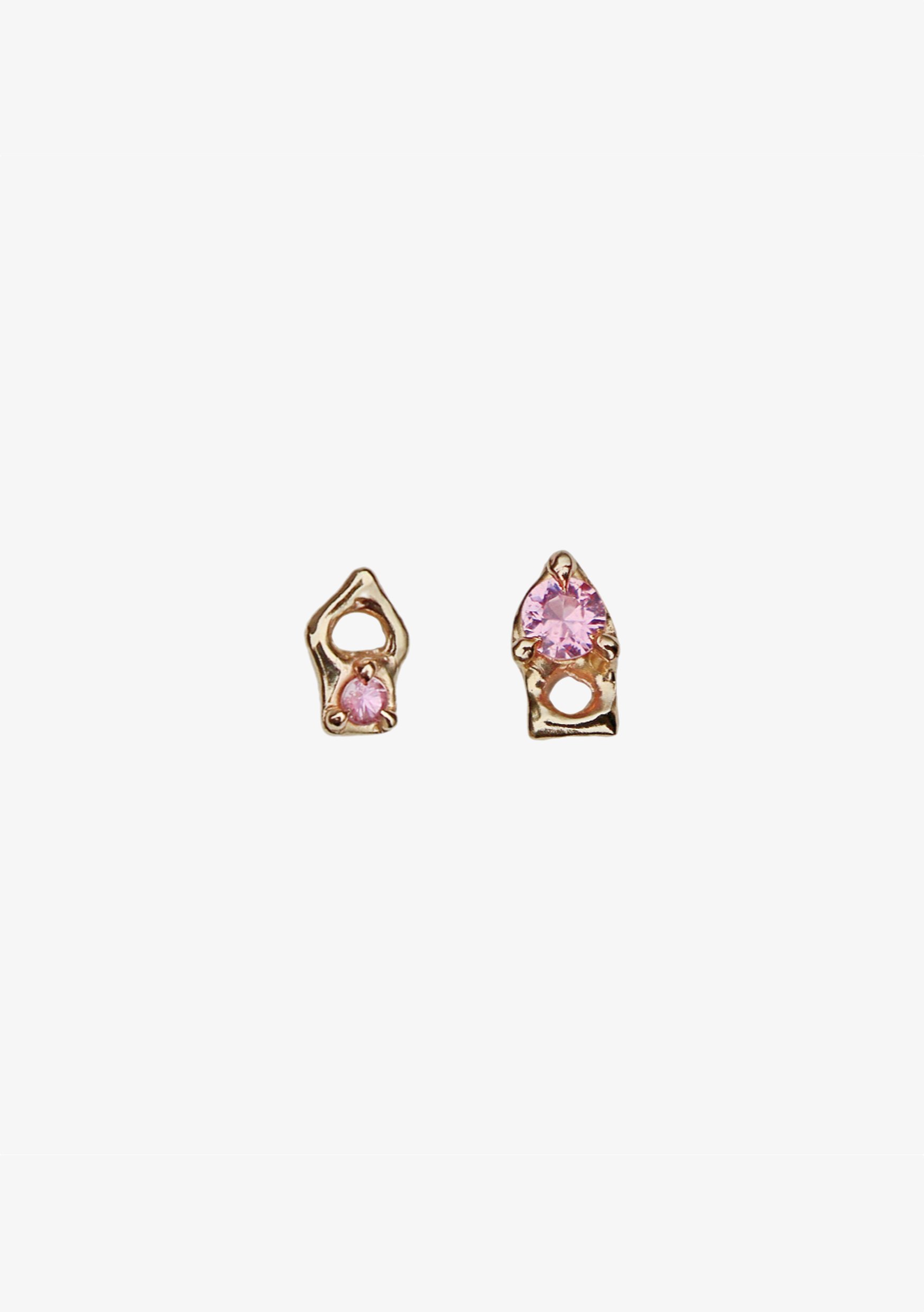 Pair of gold earrings with pink gemstones on a white background.