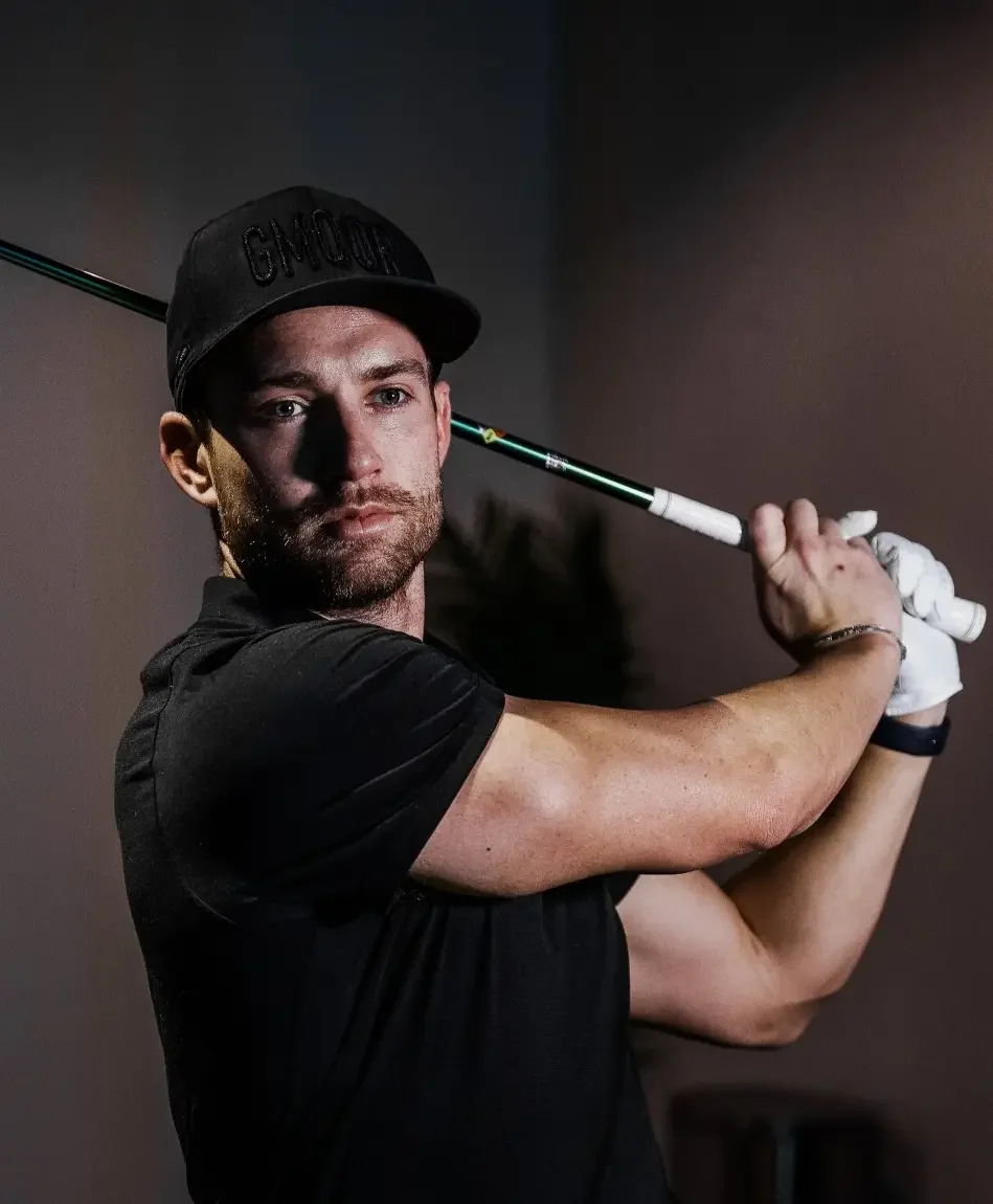 Dr. Eli Rogers, Founder of The Strength Caddie, demonstrating a powerful golf swing.