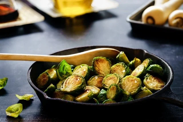 Brussels sprouts cooked and served in the cast iron skillet