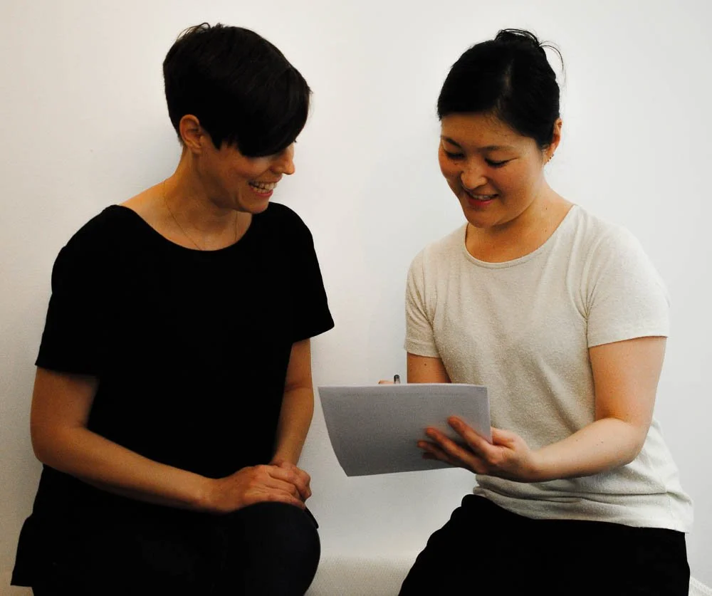 women in black and white outfit discussing collaboratively about their healthcare plan, capturing the healing in trauma-informed care is a shared responsibility