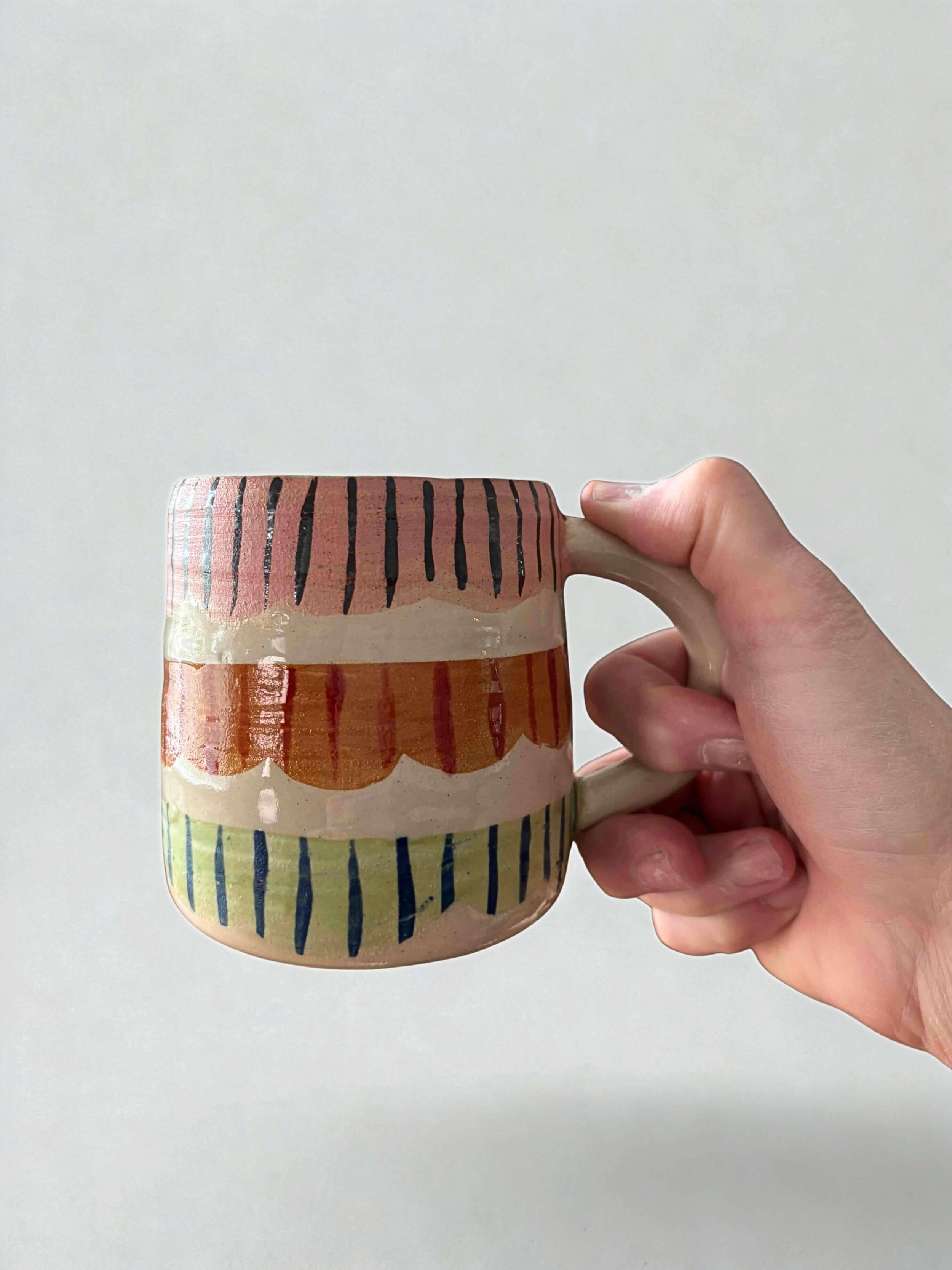 fun house mug in hand2.jpg