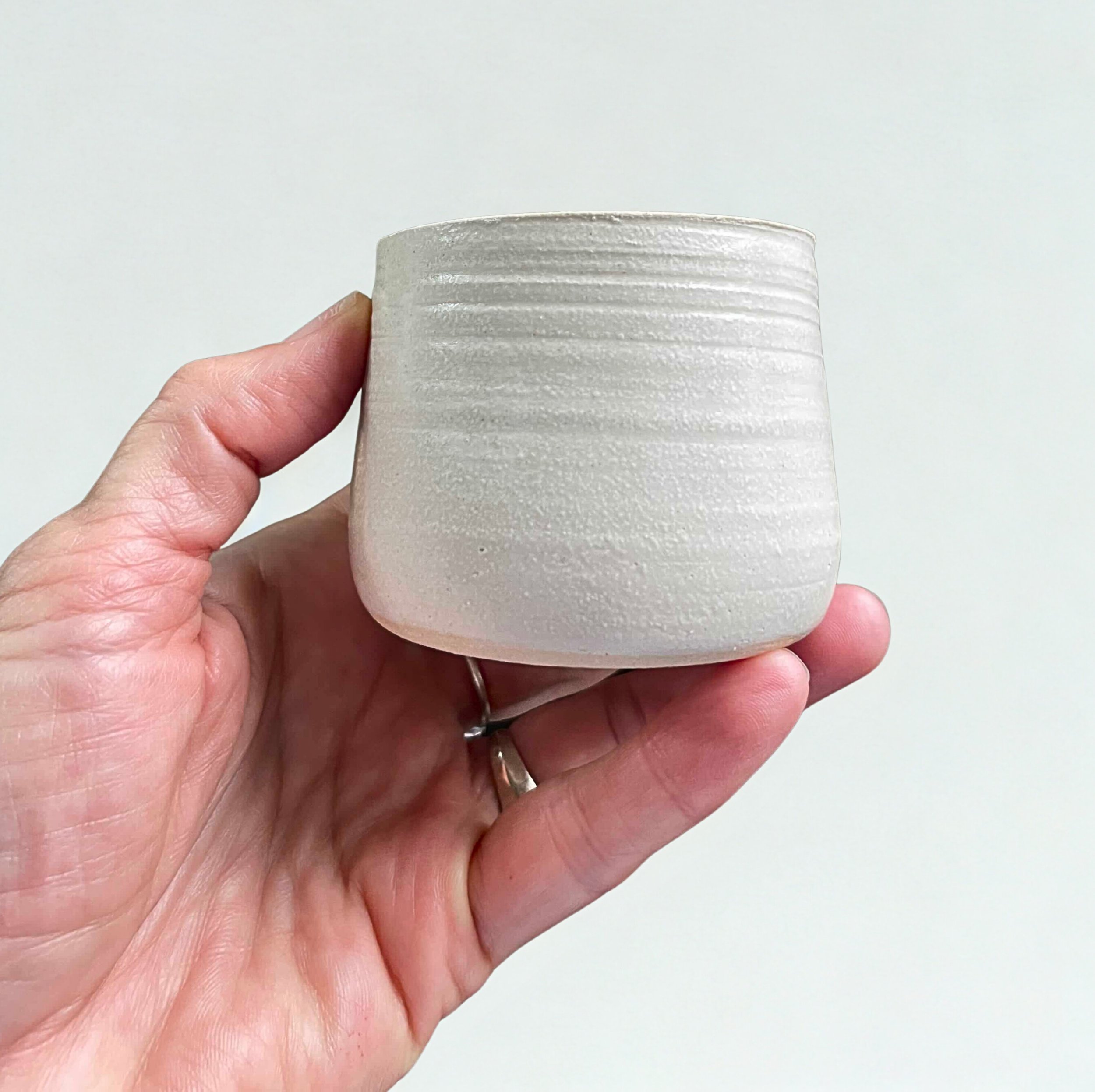 mezcal cup in hand.jpg