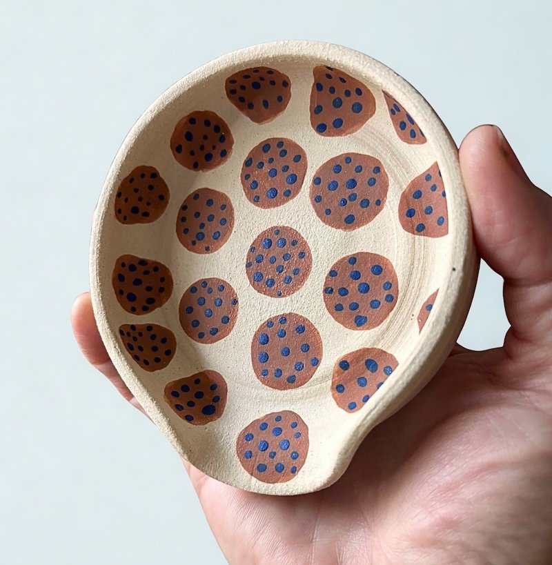 engobe dot spoon rest in hand.jpg