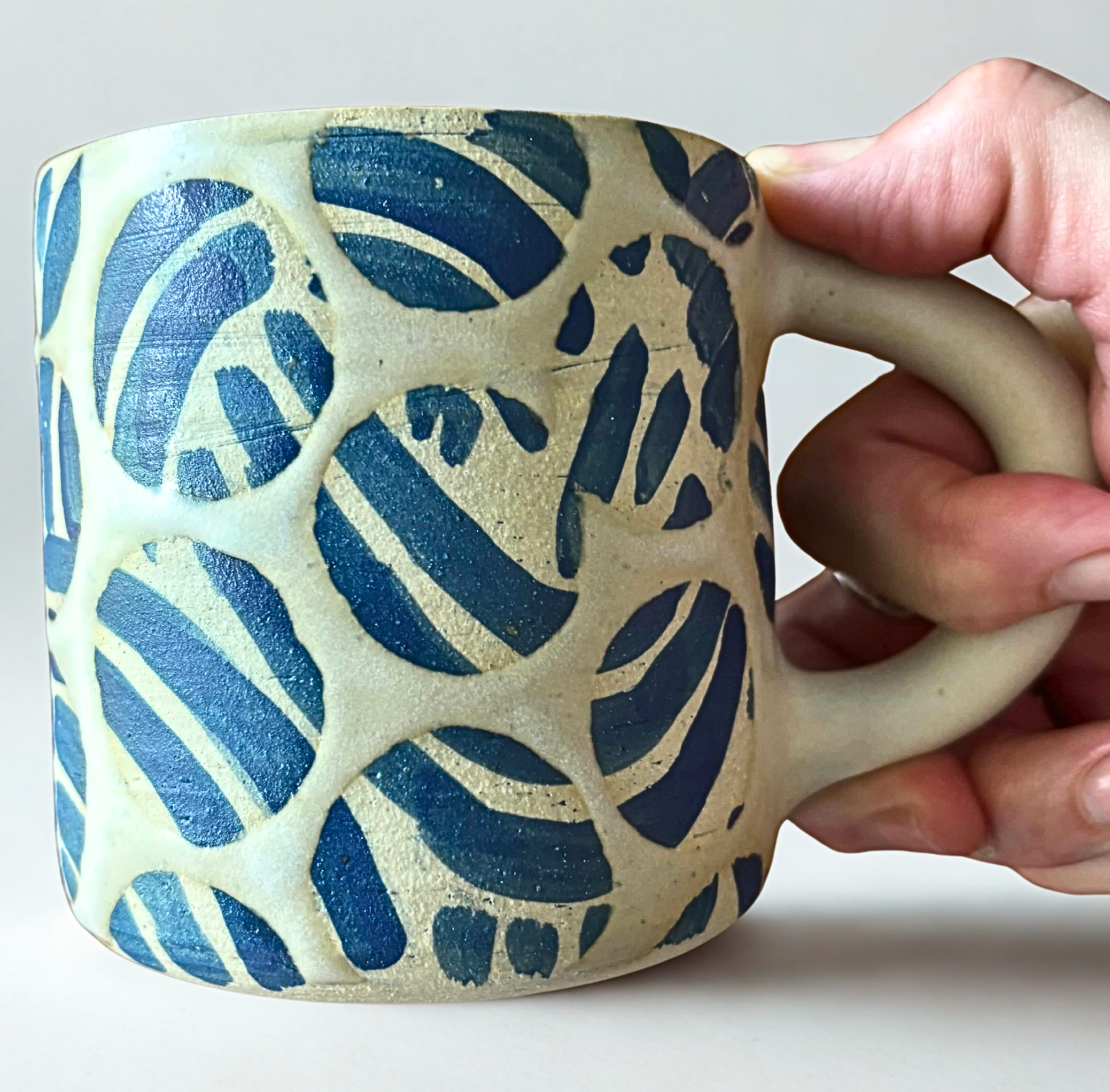 batik mug in hand.jpg
