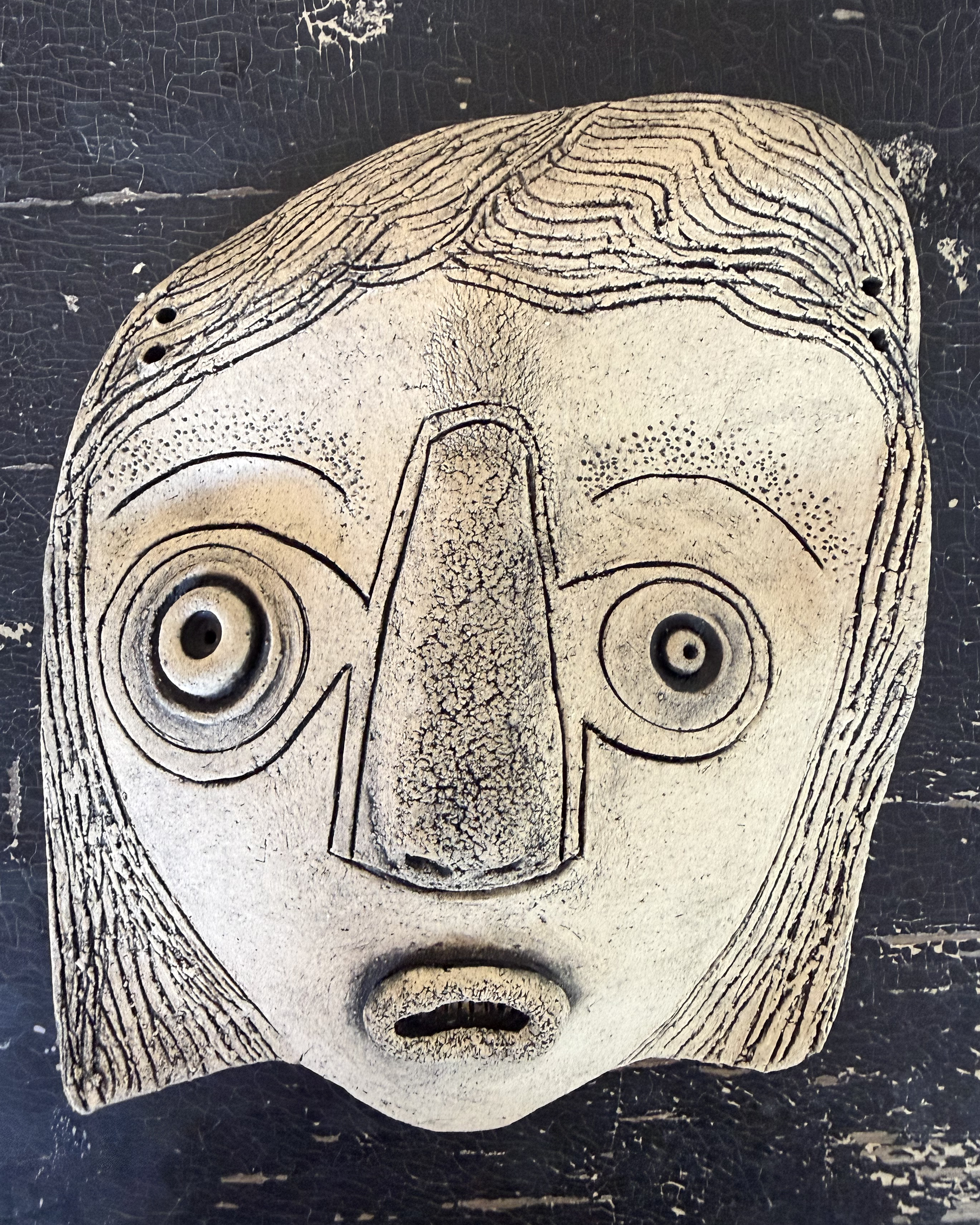 mask-olive-wall-hanging.png