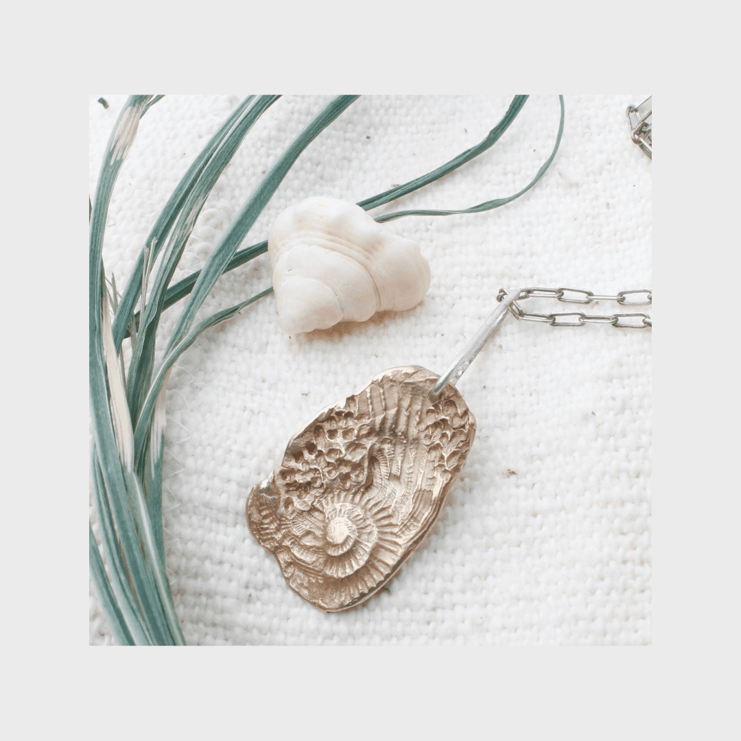 fragments bronze pendant .png