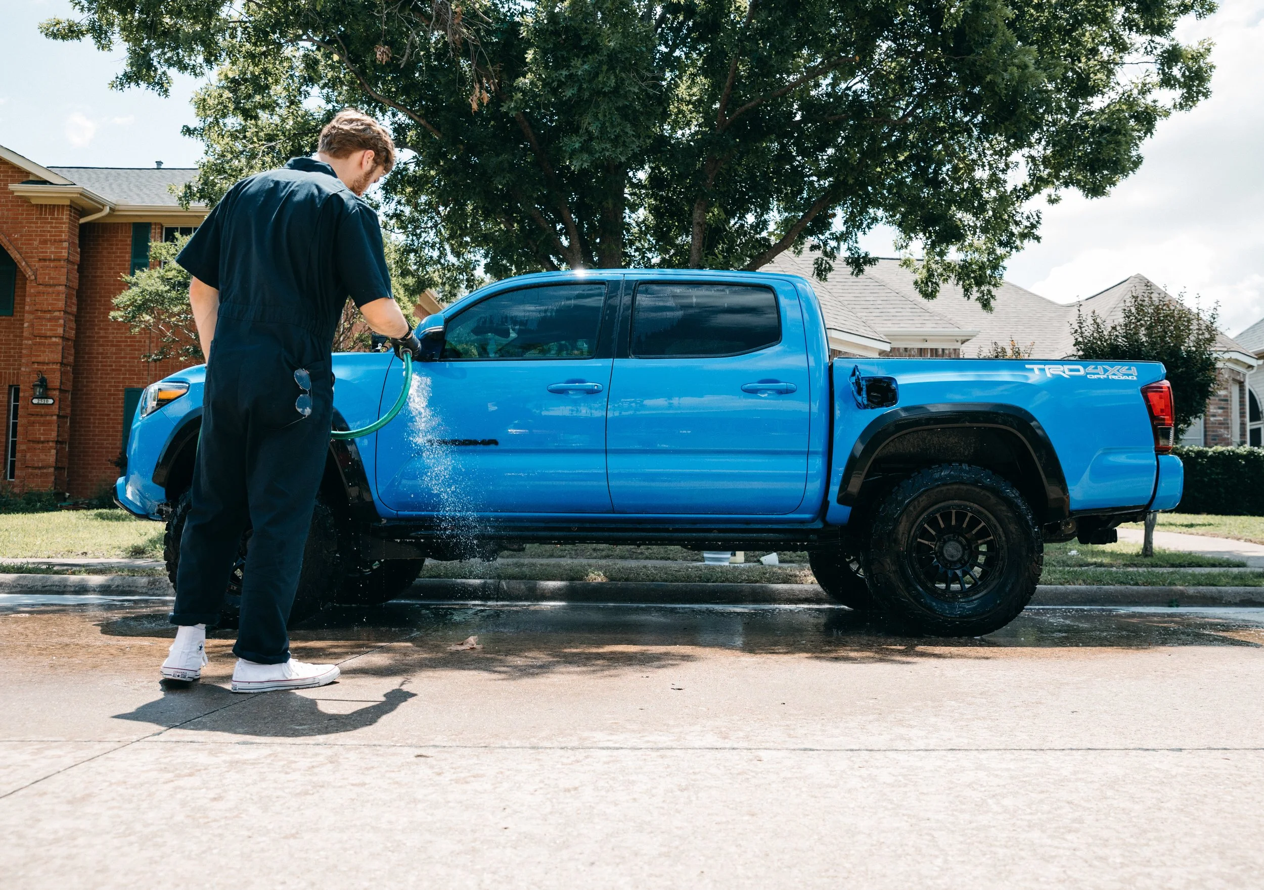 Exterior paint decontamination on luxury vehicle Highland Park TX