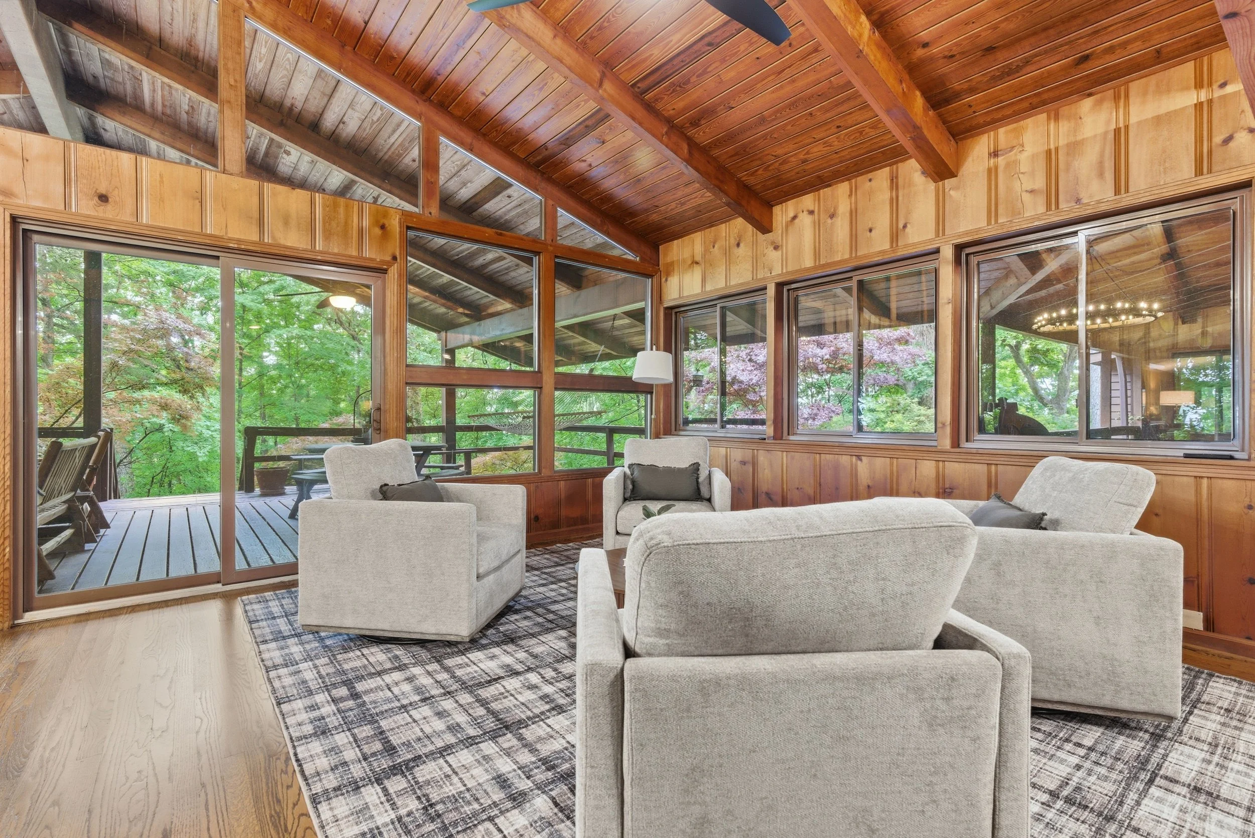 Rustic wood walls paired with warm lighting create the ultimate lake house vibe.