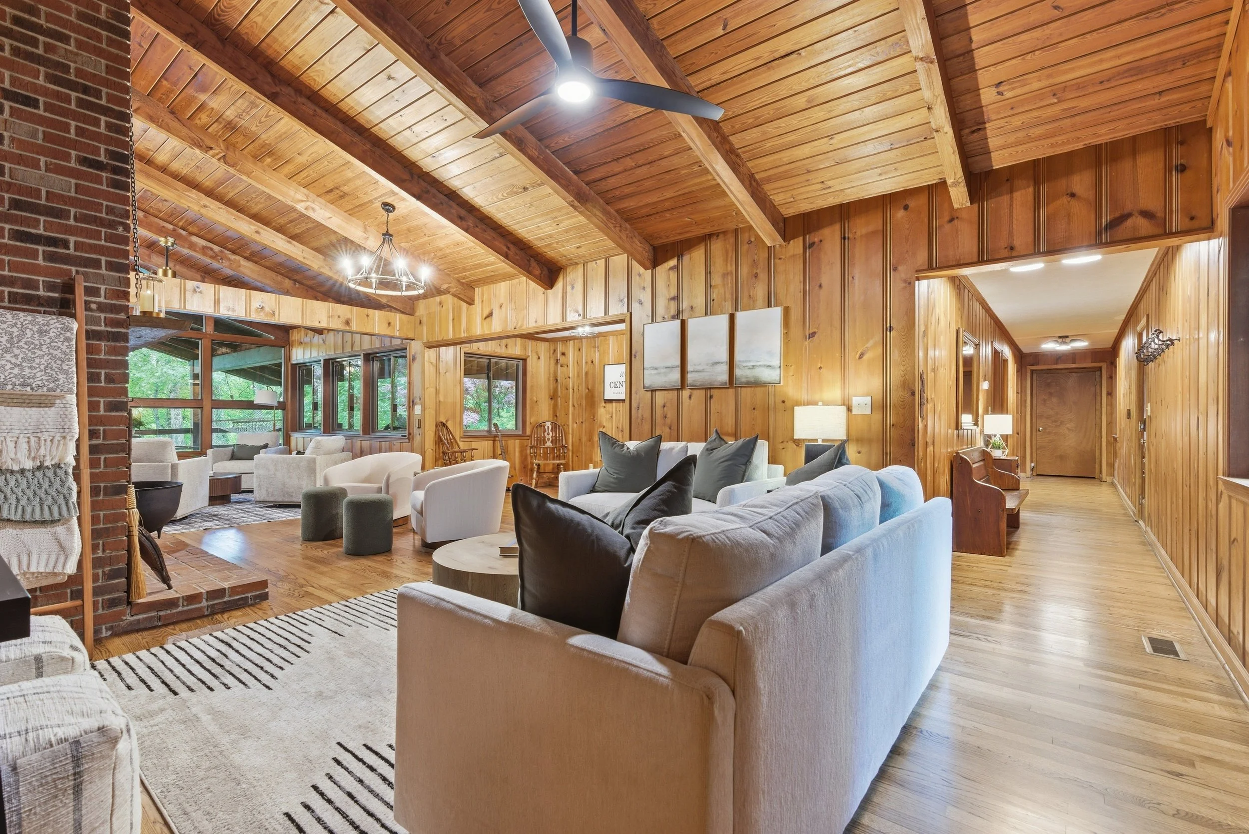 Warm wood tones and layered textures make this space feel welcoming year round.