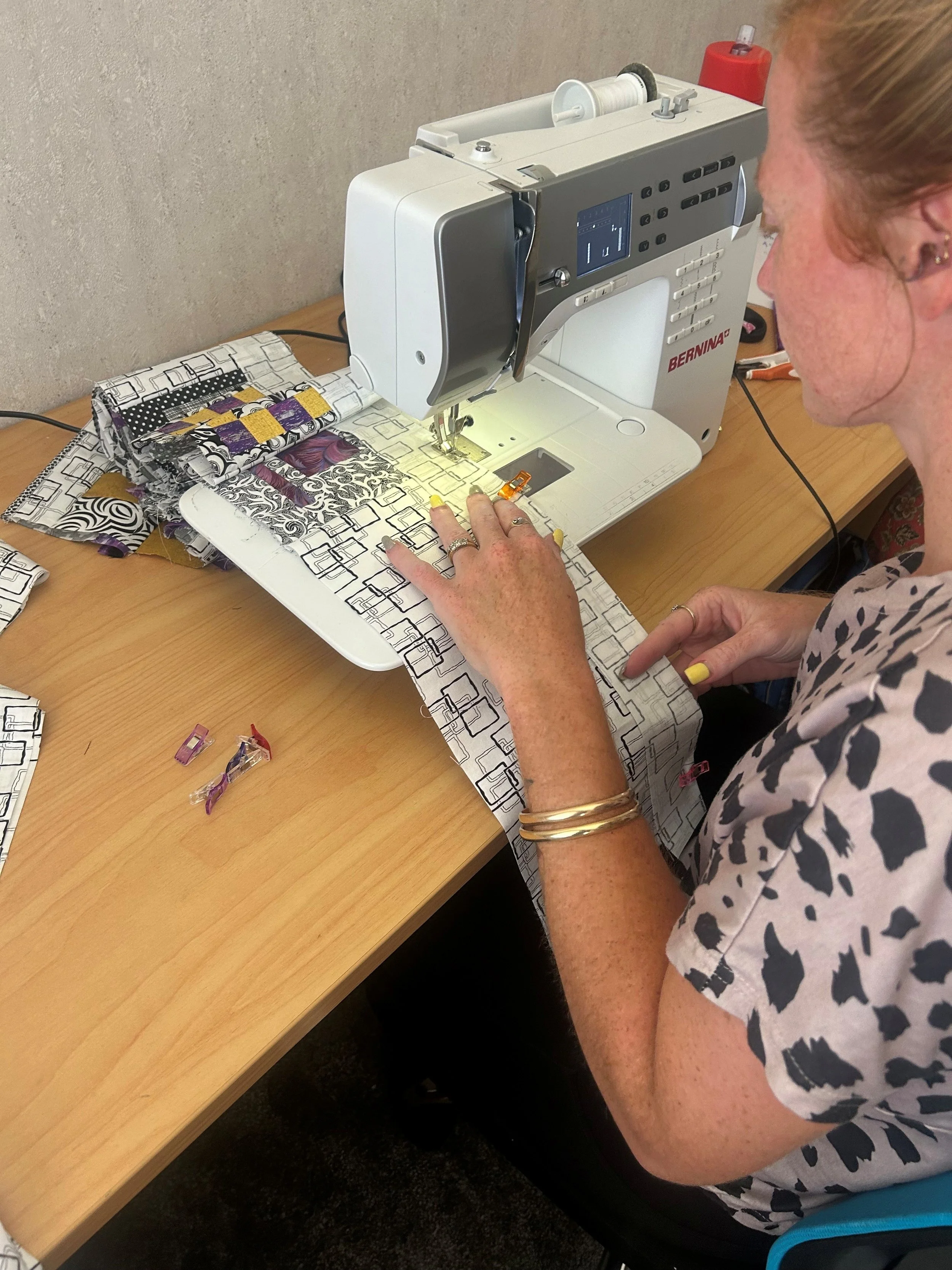 Tessa making a quilt