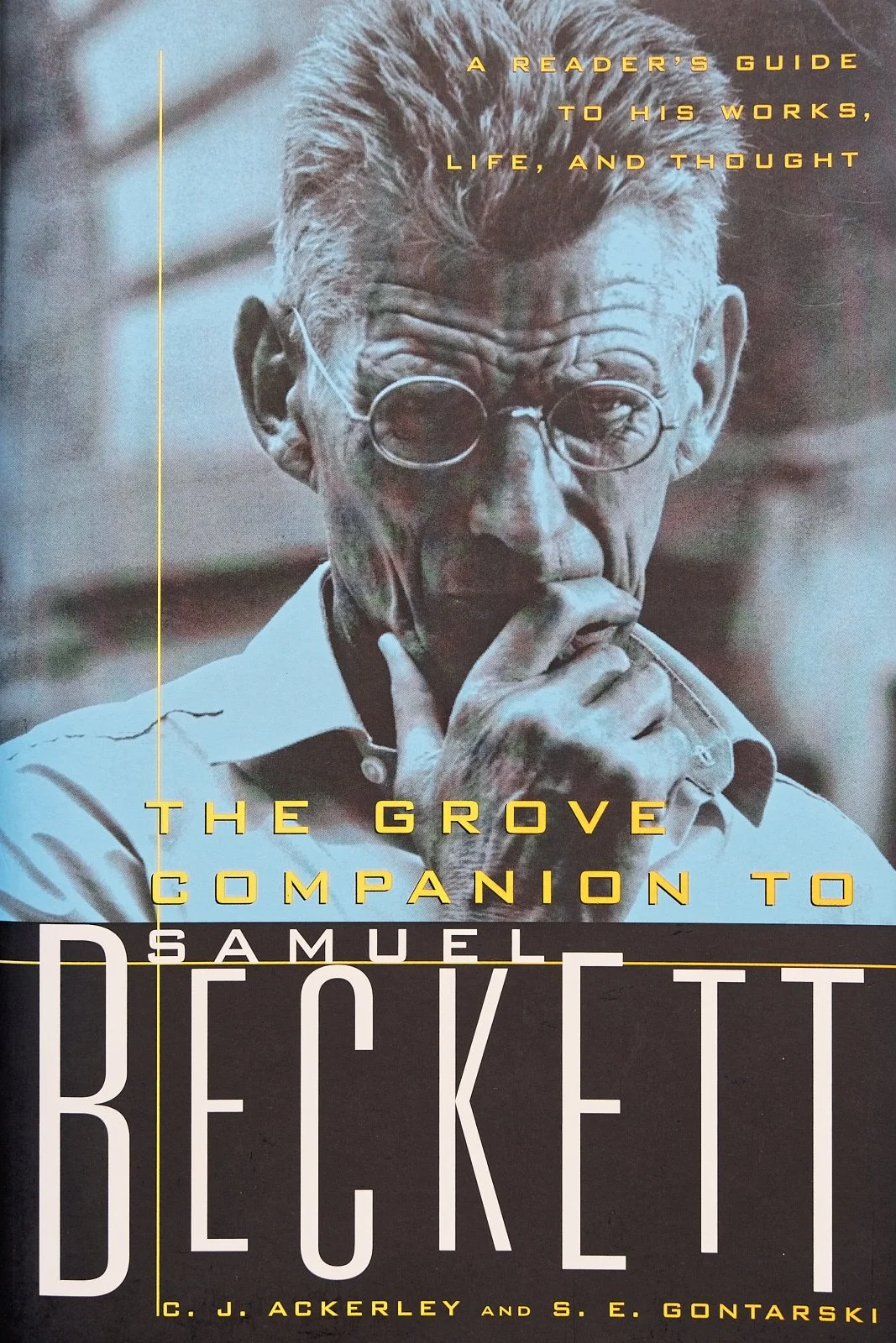Book cover of 'The Grove Companion to Samuel Beckett' featuring a black-and-white photograph of Samuel Beckett.