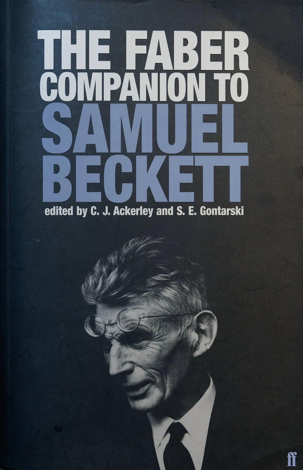 Book cover titled "The Faber Companion to Samuel Beckett" edited by C. J. Ackerley and S. E. Gontarski, featuring a black and white photo of Samuel Beckett.