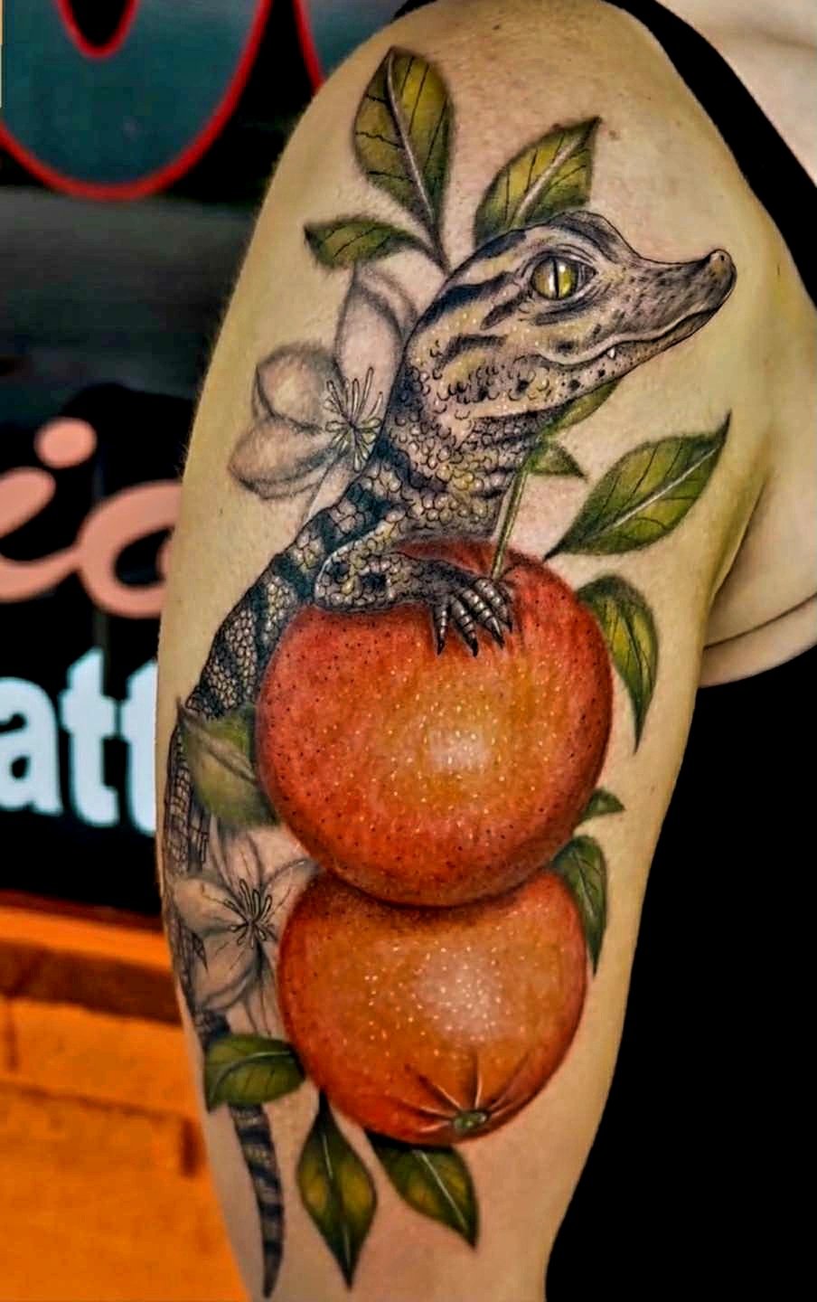 Realistic American Alligator in an Orange Tree color tattoo done by TattoosbyNoelle ™ at Ink Therapy