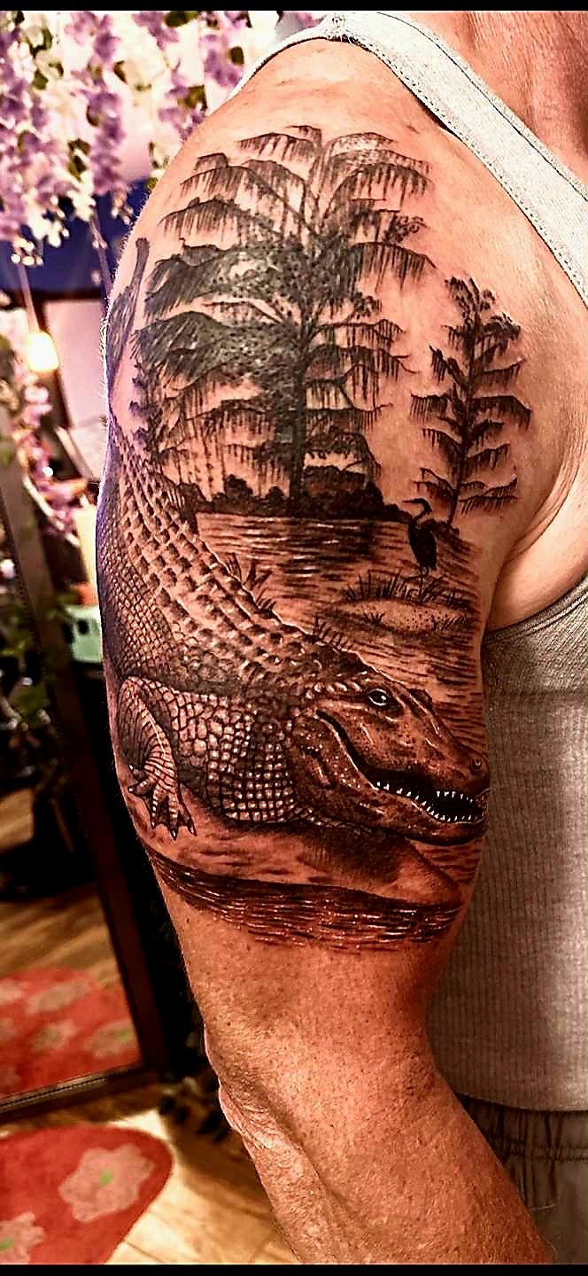 Realistic American Alligator in black and gray tattoo done by TattoosbyNoelle ™ at Ink Therapy