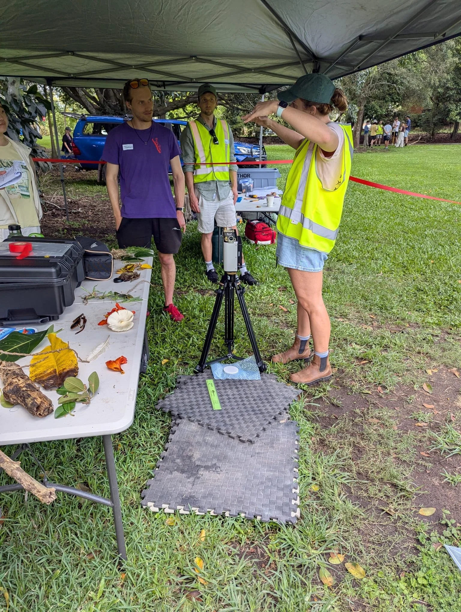 PhD student Joanna Smart (yellow vest in foreground)  demonstrating collection of spectral reflectance measurements