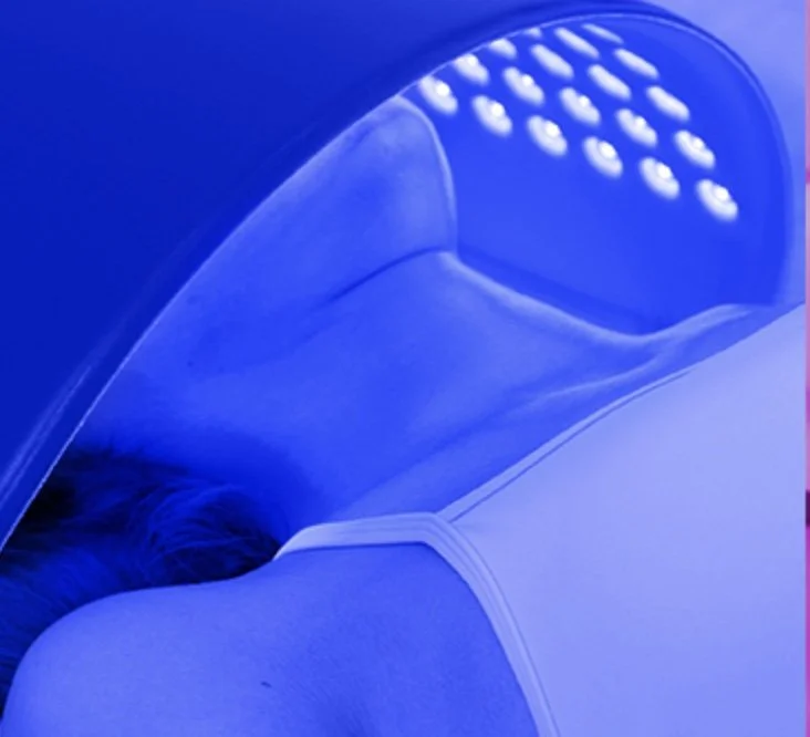 Person receiving a Blue LED Light treatment.